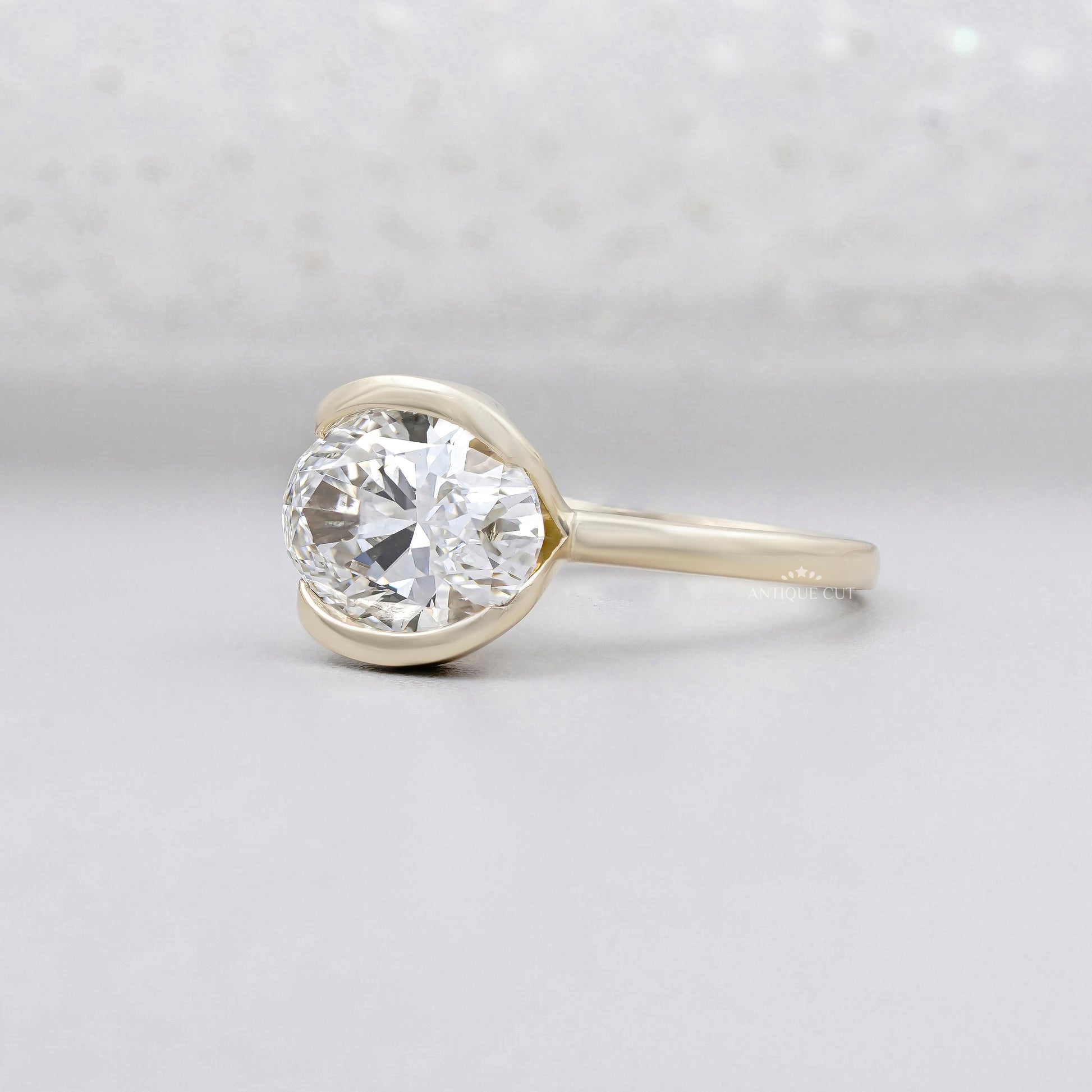 bezel set oval diamond ring yellow gold