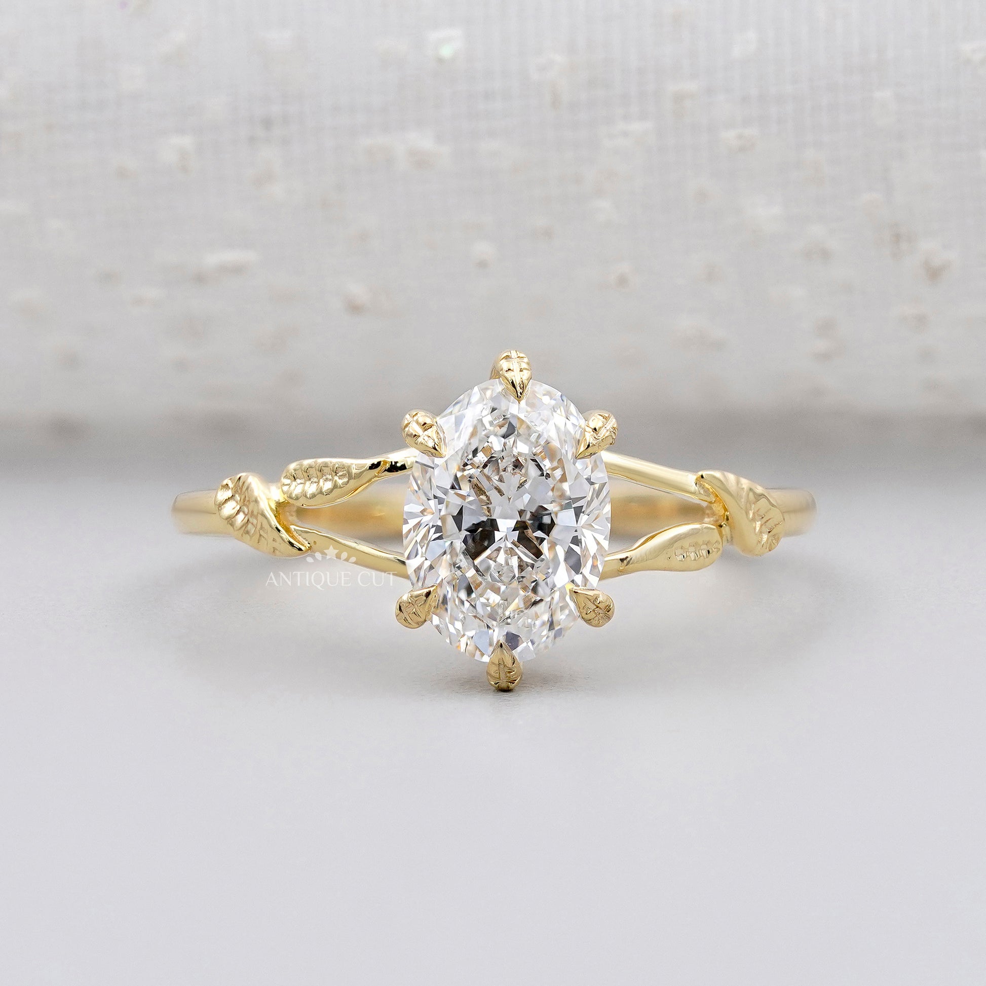 Vintage inspired floral leaf oval solitaire ring