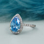 Lab grown blue diamond pear ring white gold halo
