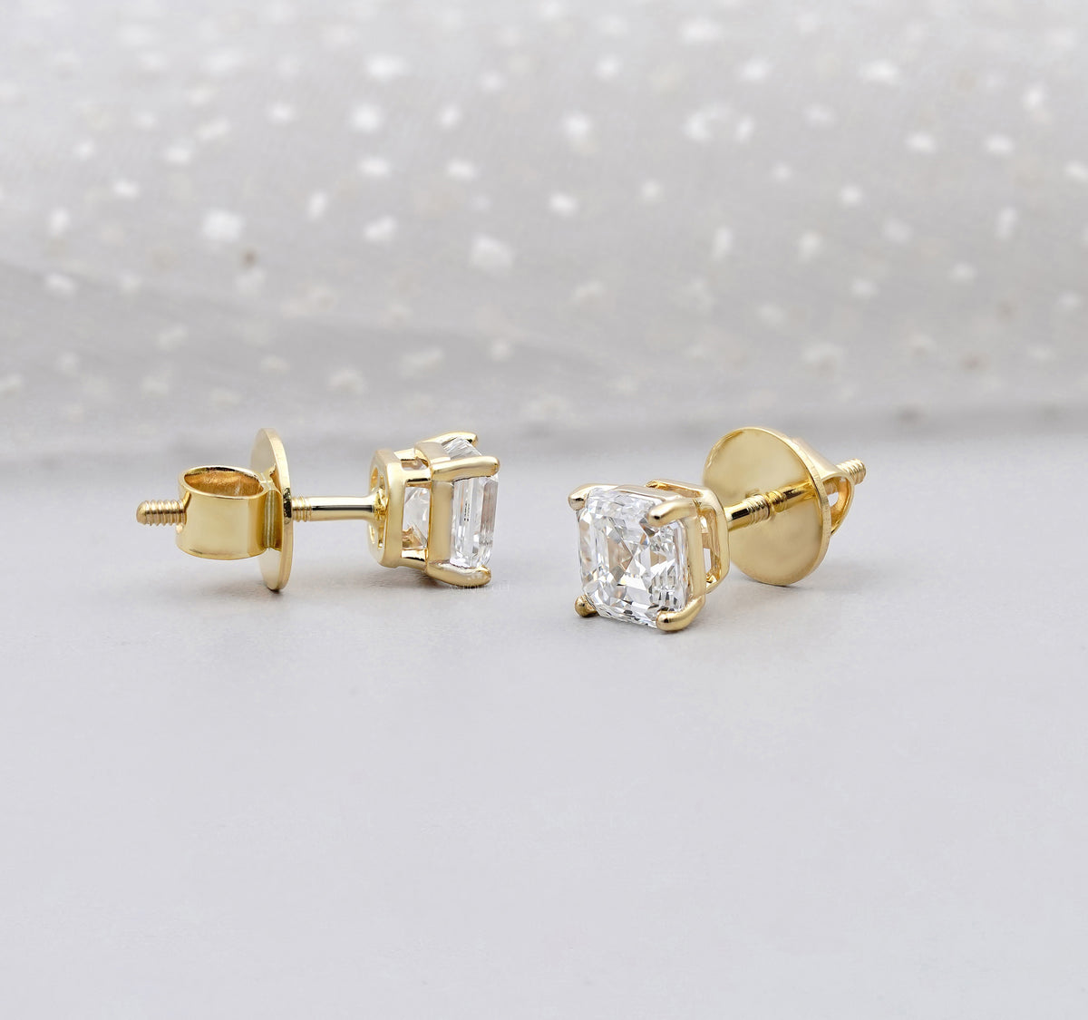 Asscher Cut Diamond Stud Earrings shown as classic solitaire studs