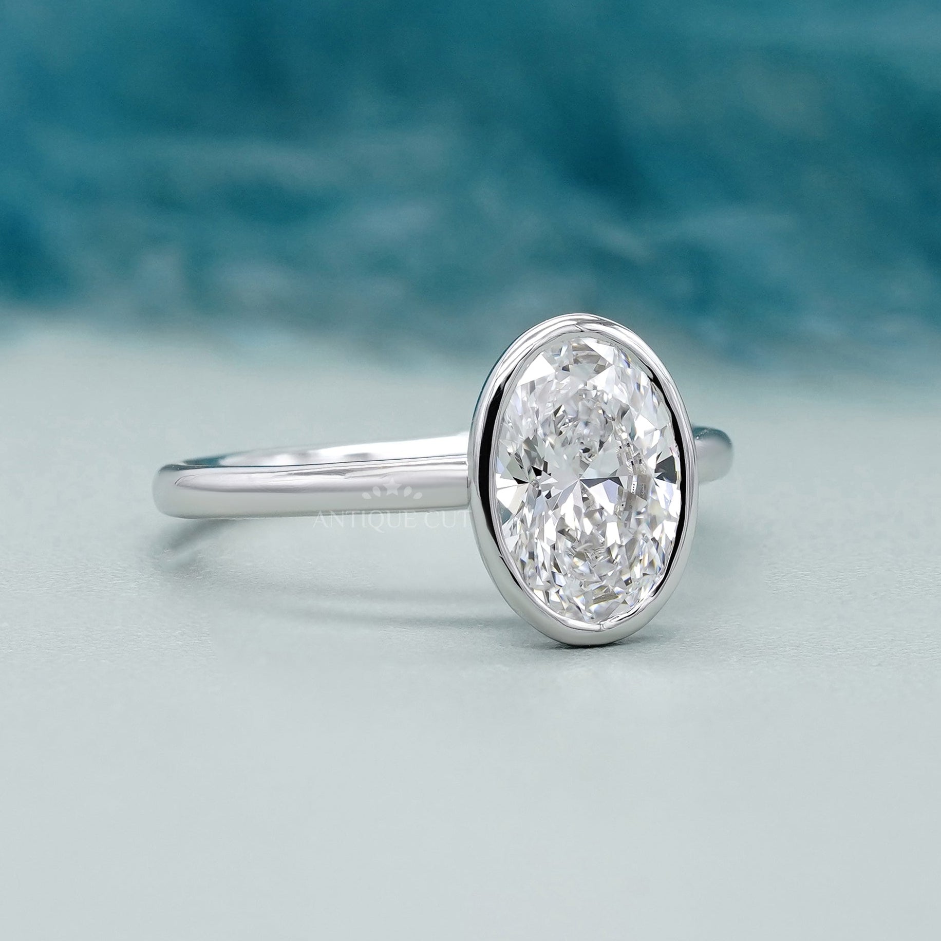 White gold bezel set oval diamond ring