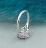White gold engagement ring featuring a round center diamond