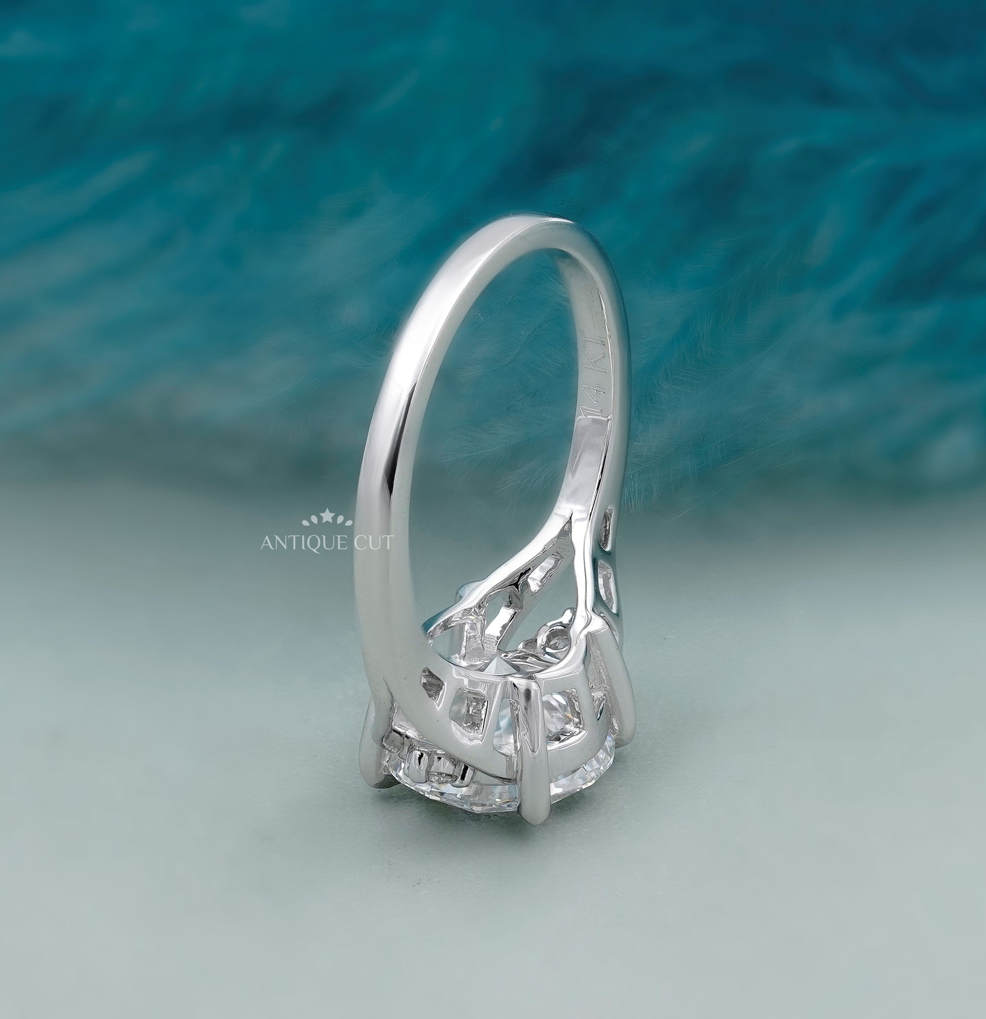 White gold engagement ring featuring a round center diamond