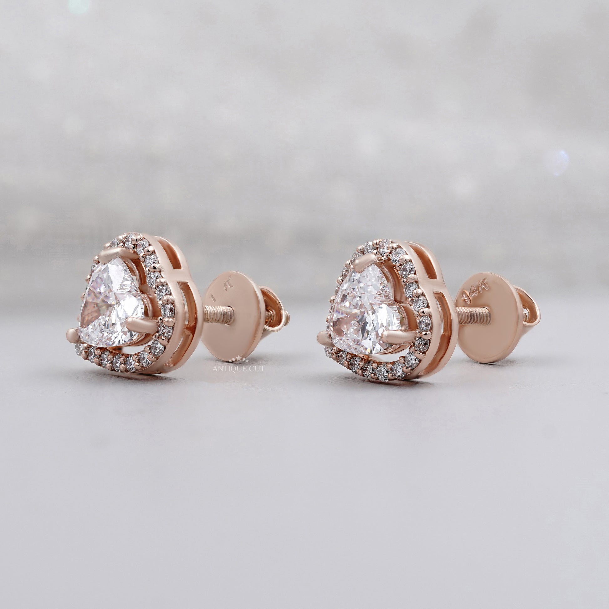 Heart cut lab grown diamond studs with halo setting