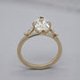 Yellow gold engagement ring with hidden halo detail