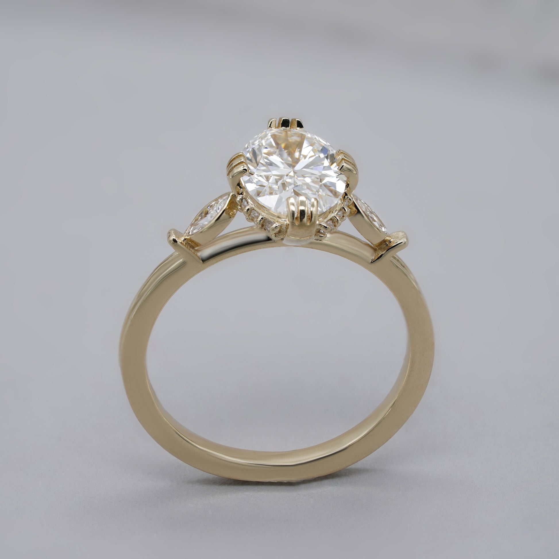 Yellow gold engagement ring with hidden halo detail