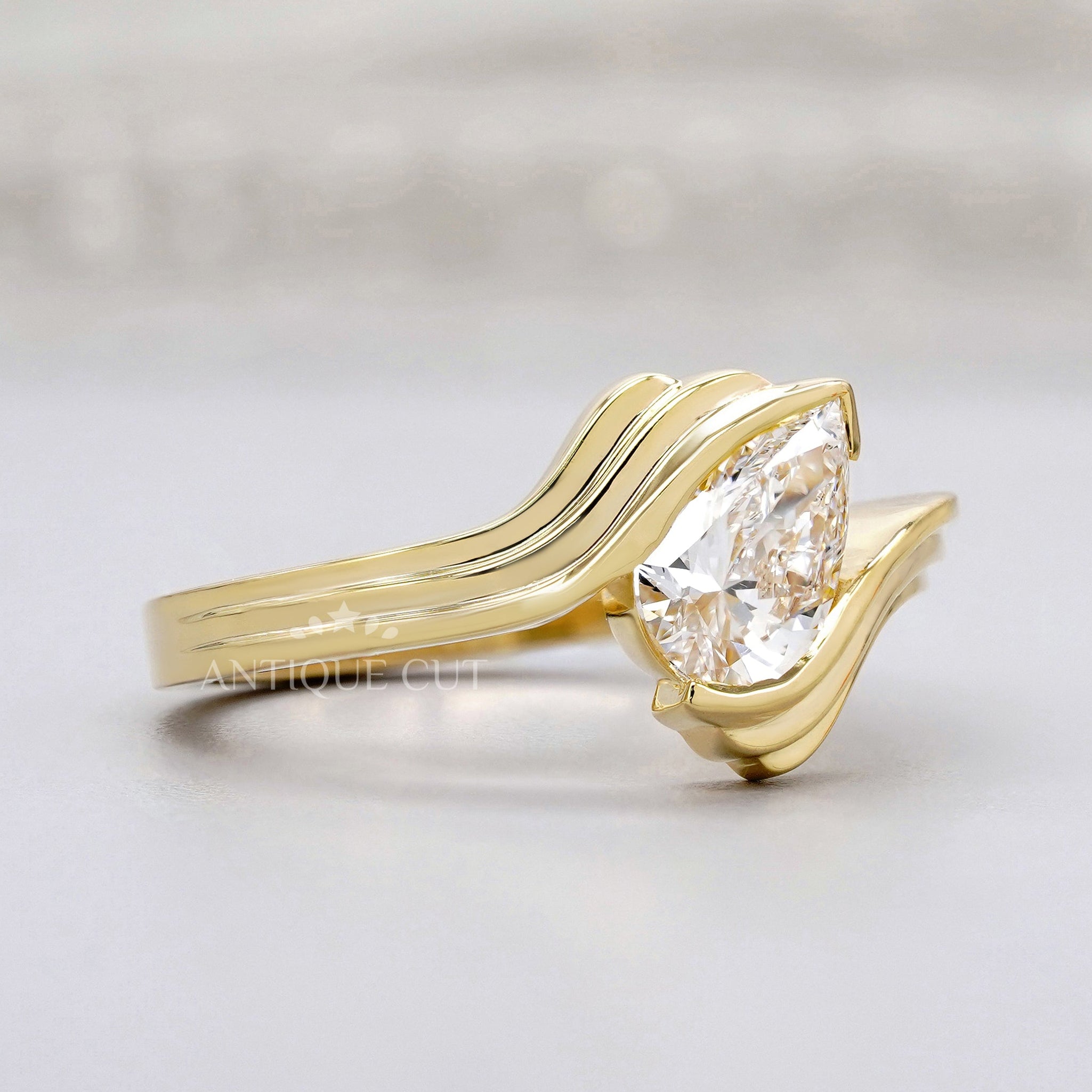 IGI certified pear diamond engagement ring yellow gold