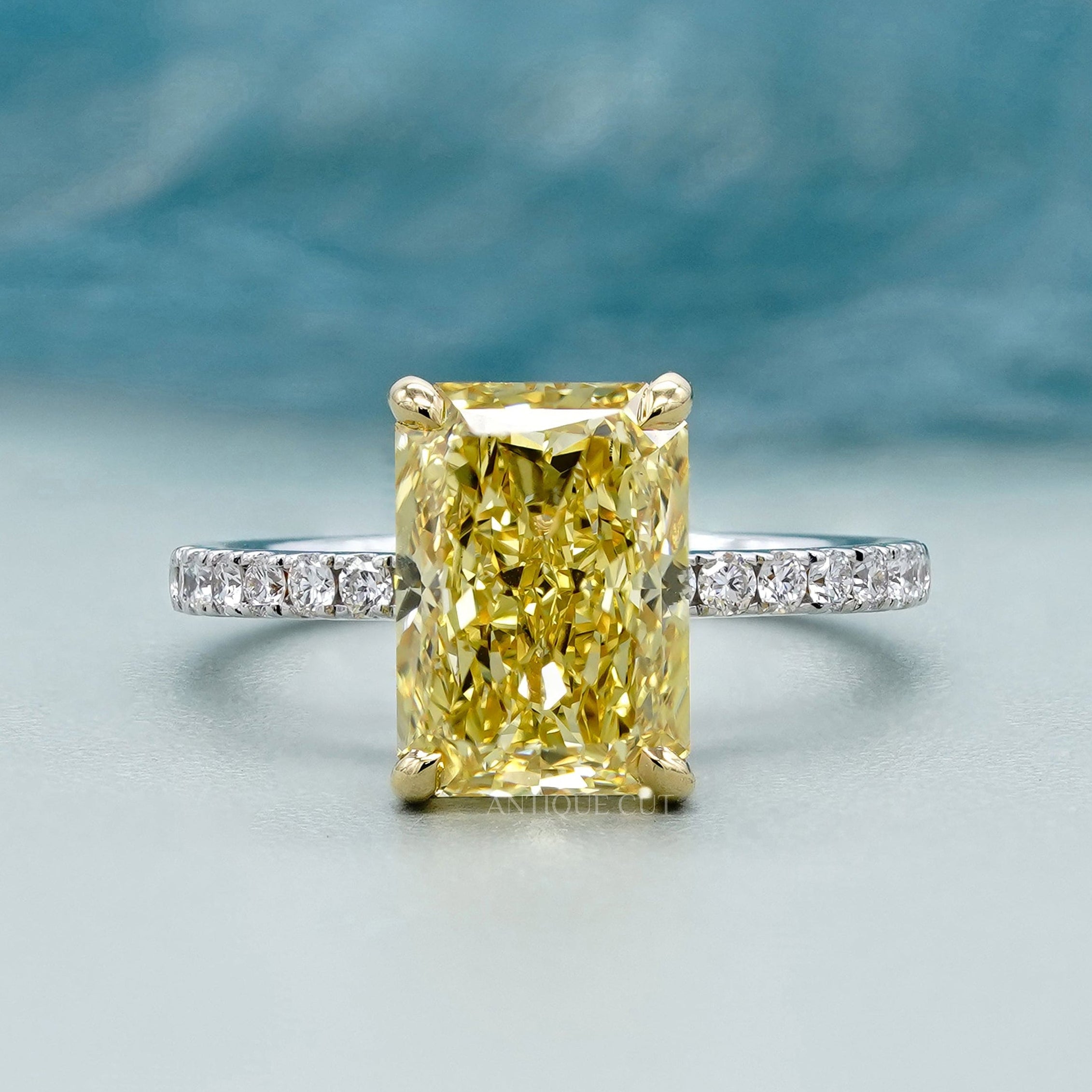 Yellow radiant cut diamond ring two tone hidden halo pave band