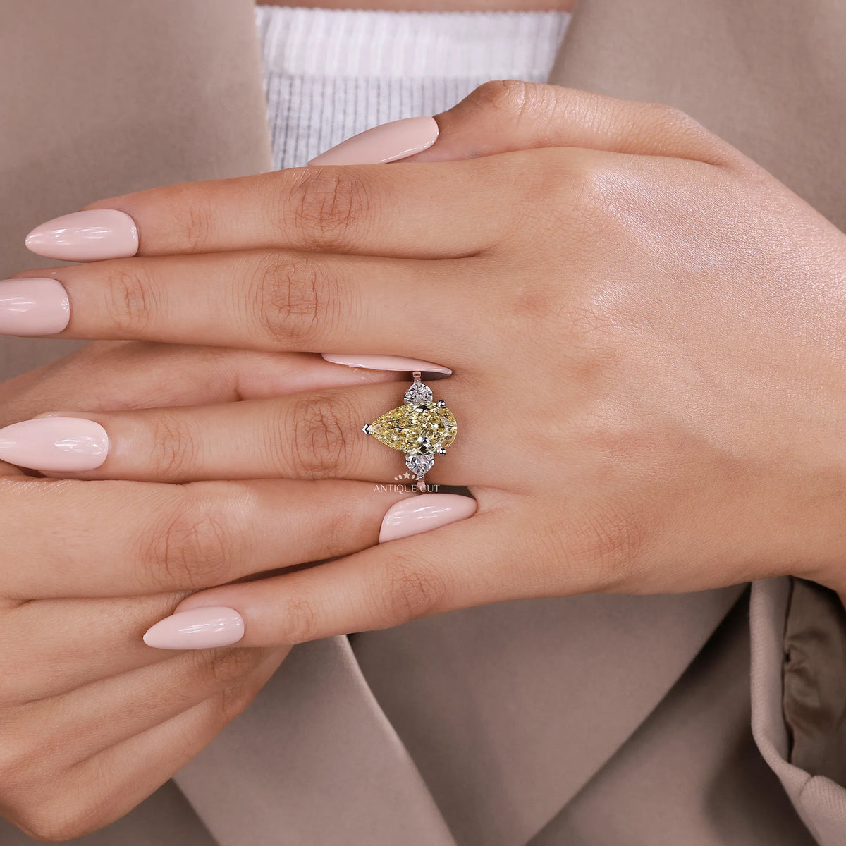 Three stone yellow pear diamond ring in white gold