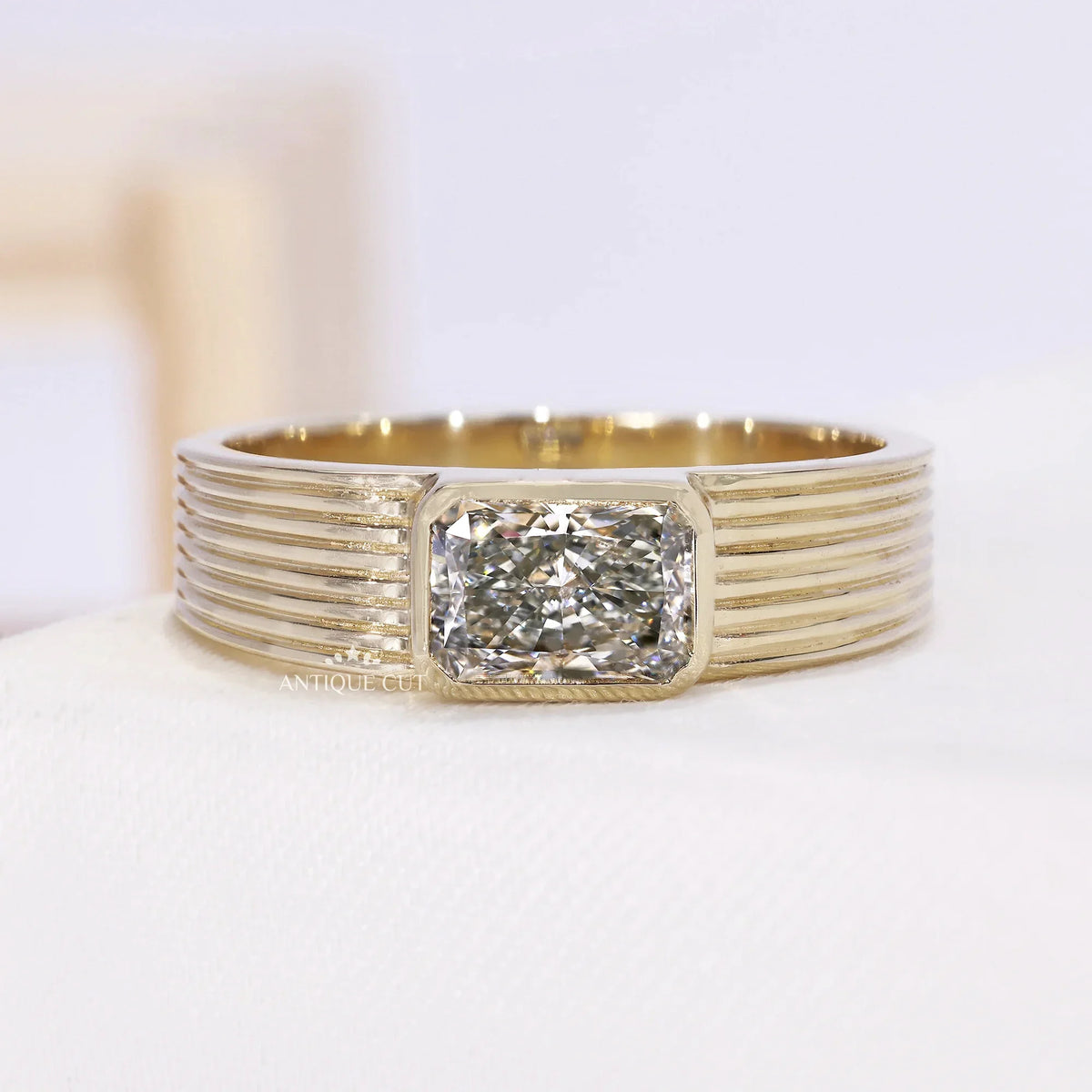 1.50 carat emerald shape diamond engagement ring in yellow gold
