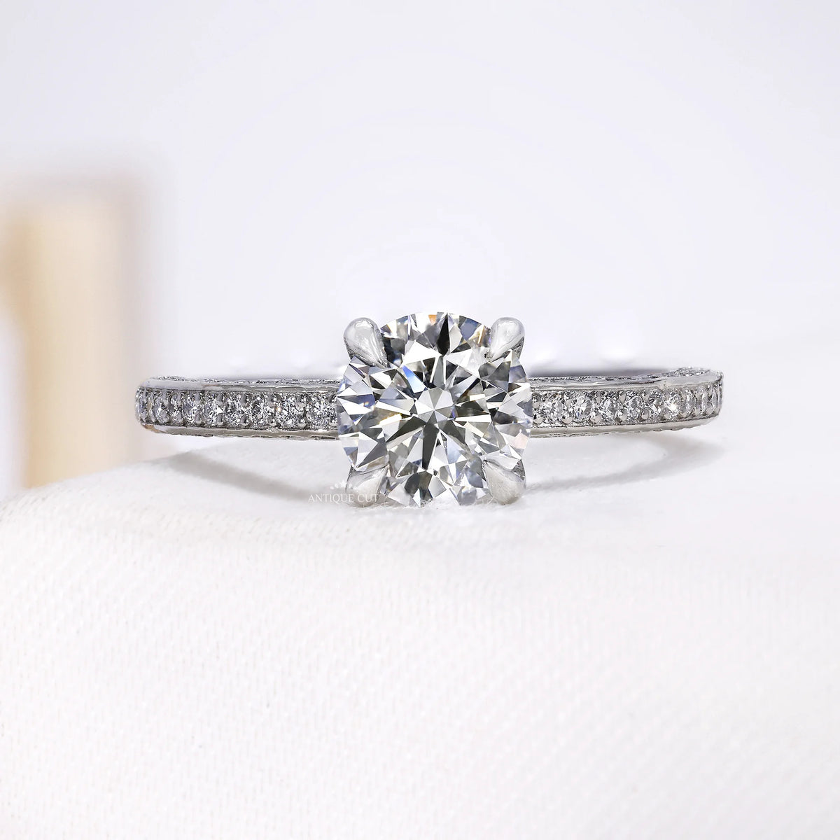 Round shape lab grown diamond engagement ring with white gold pavé band