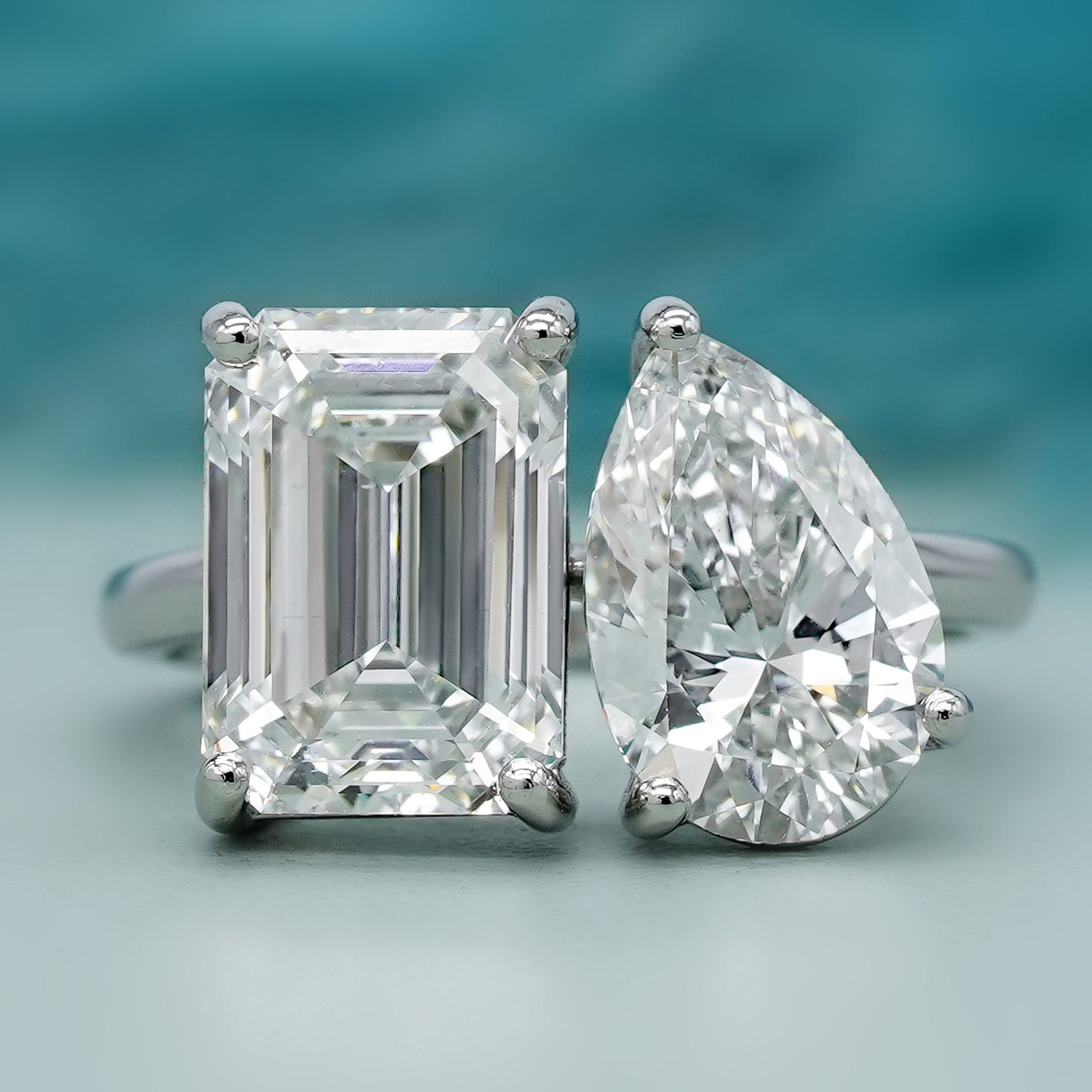 Toi Et Moi emerald and pear engagement ring in white gold