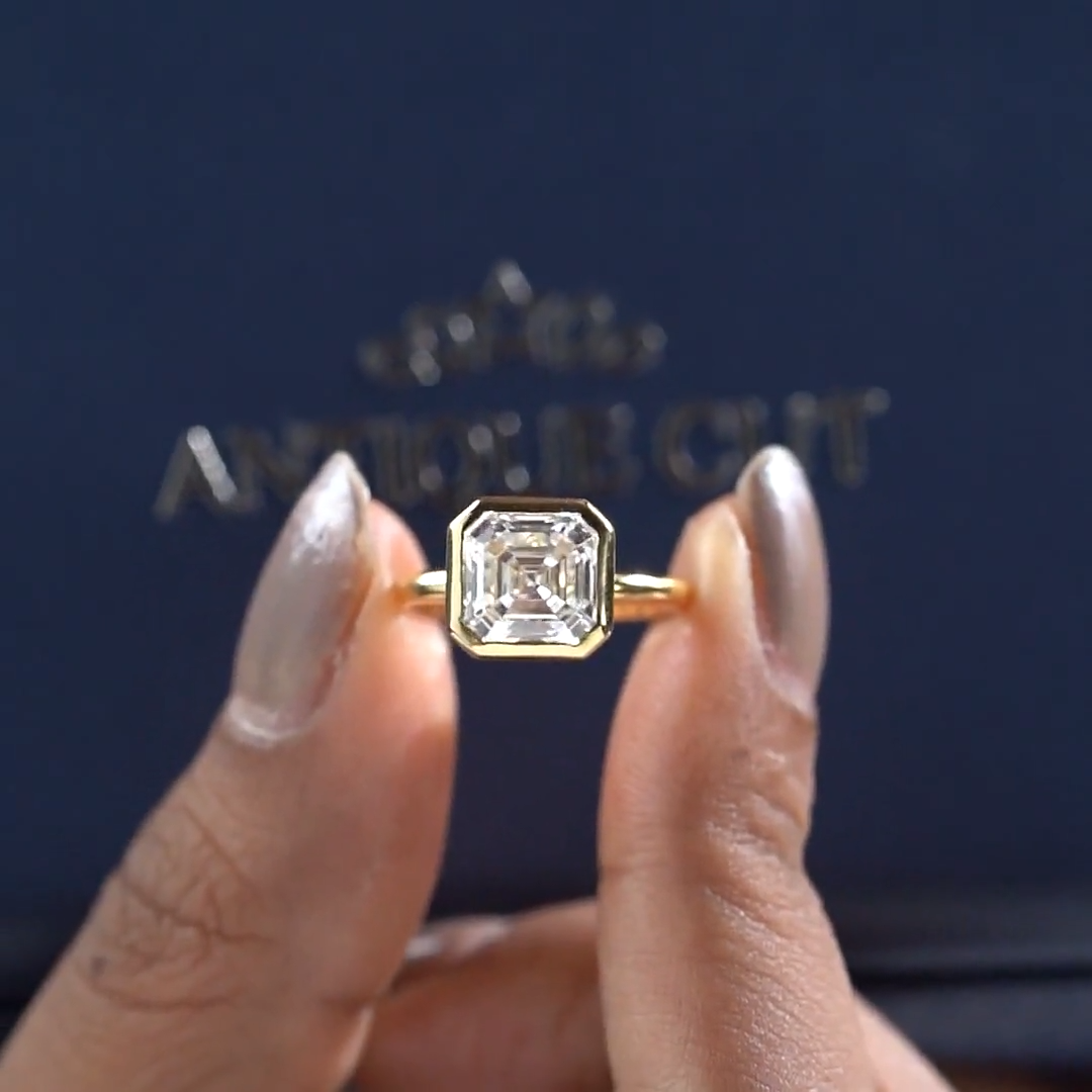 Asscher Cut Engagement Ring With Bezel Setting In Yellow Gold