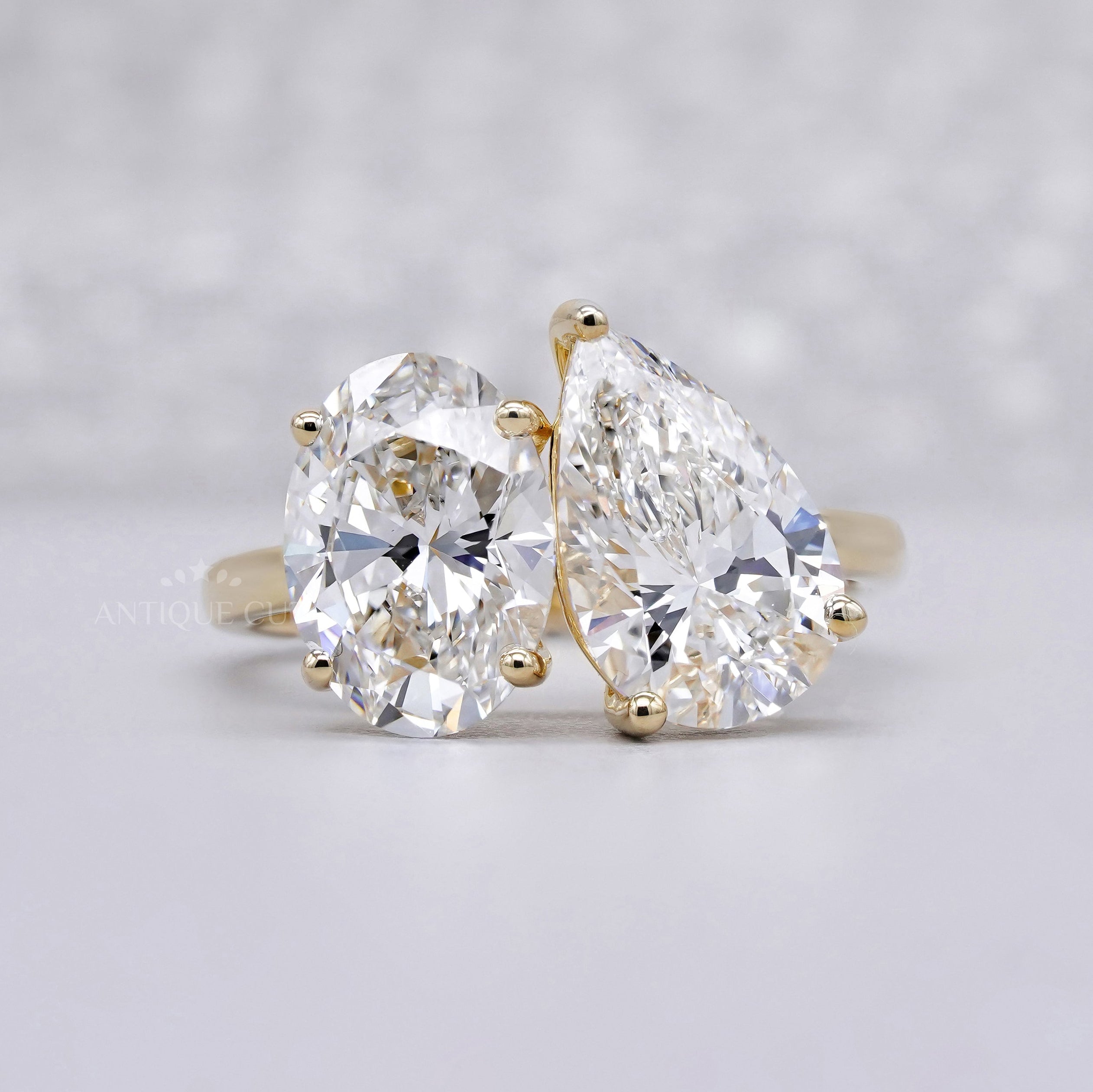 Toi Et Moi oval and pear engagement ring in yellow gold