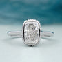 Cushion halo engagement ring bezel set white gold