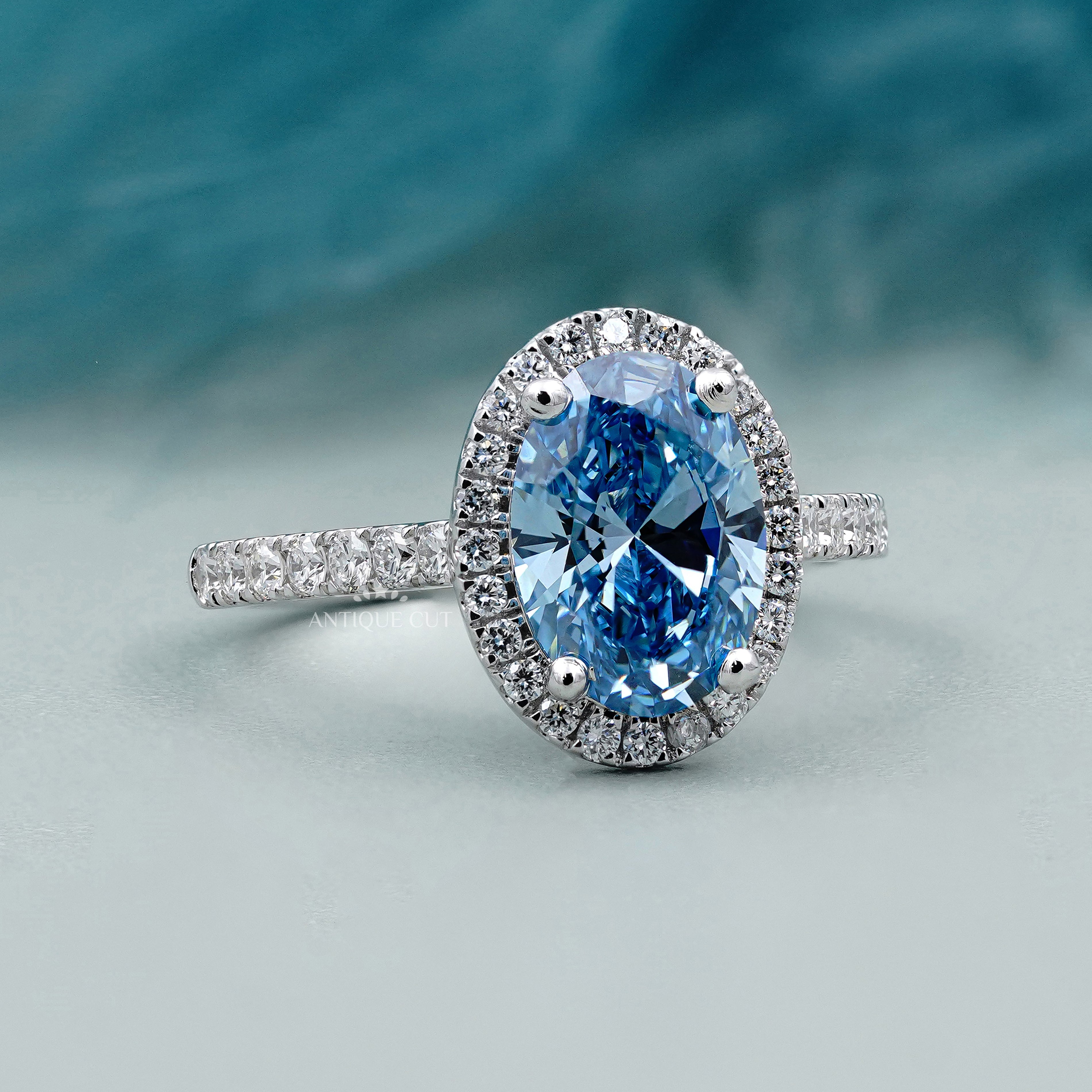 Oval shaped ring with halo diamond setting