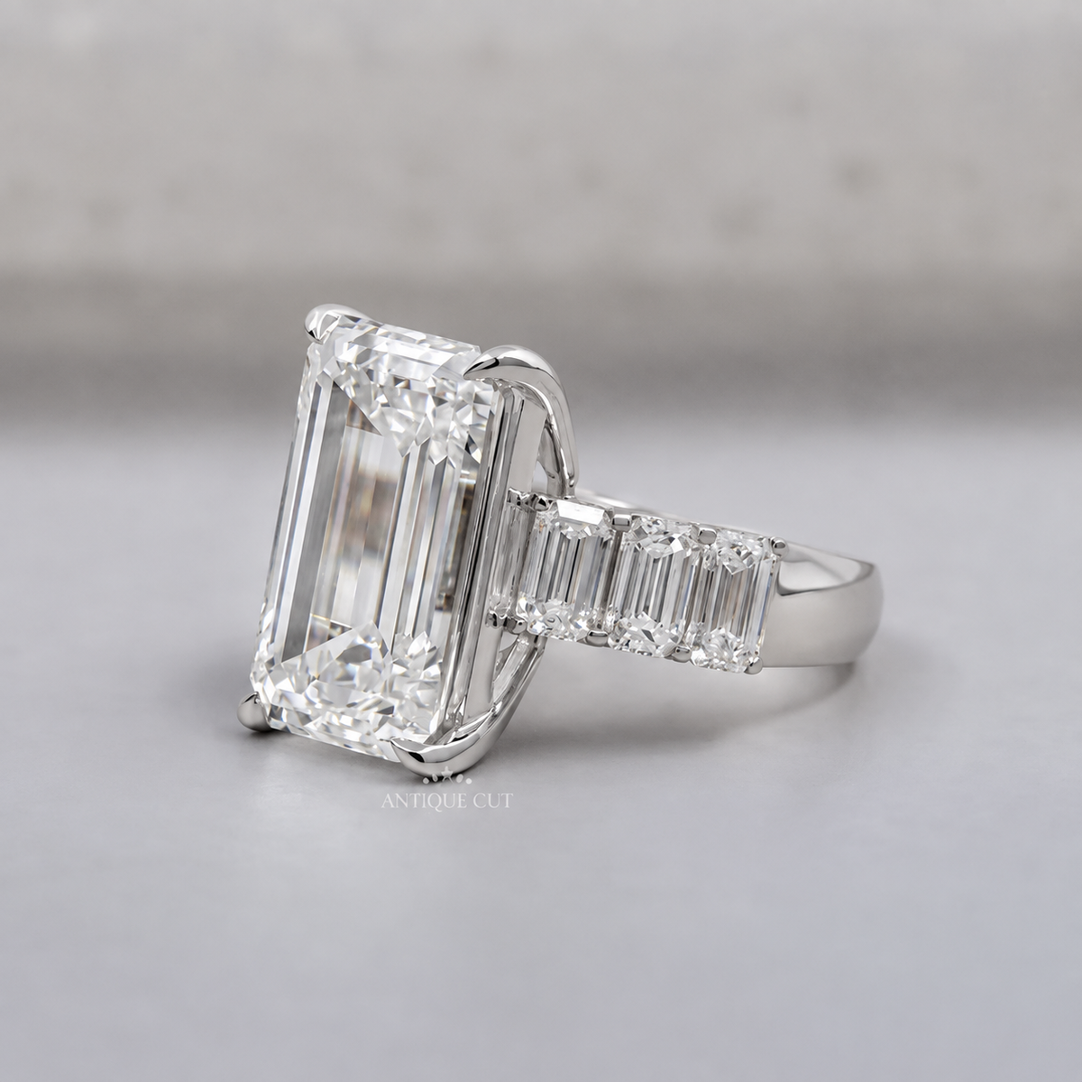 9.0 Carat Lab Grown Emerald Cut Engagement Ring with Tapered Side Stones