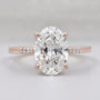 Oval diamond engagement ring with pavé band in rose gold