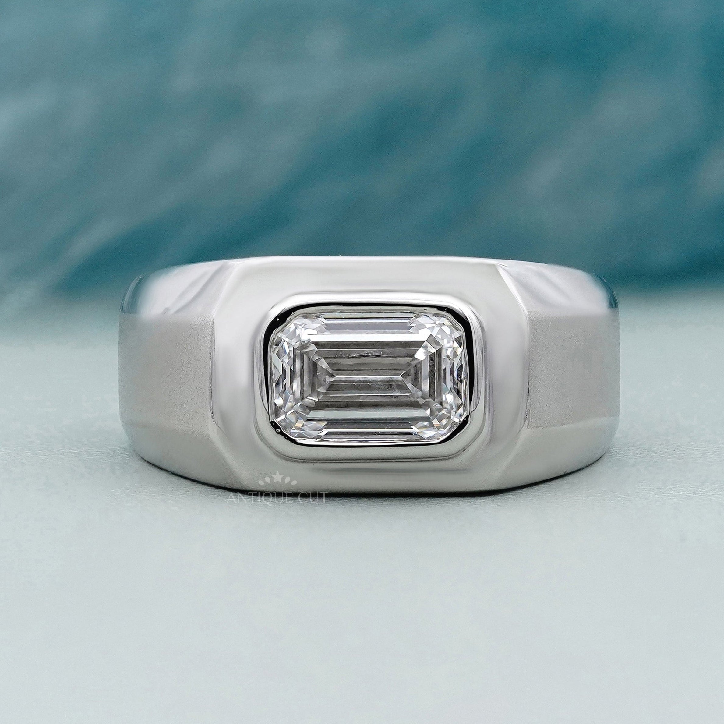 East west emerald cut engagement ring in white gold