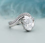 Oval bypass engagement ring claw prong setting