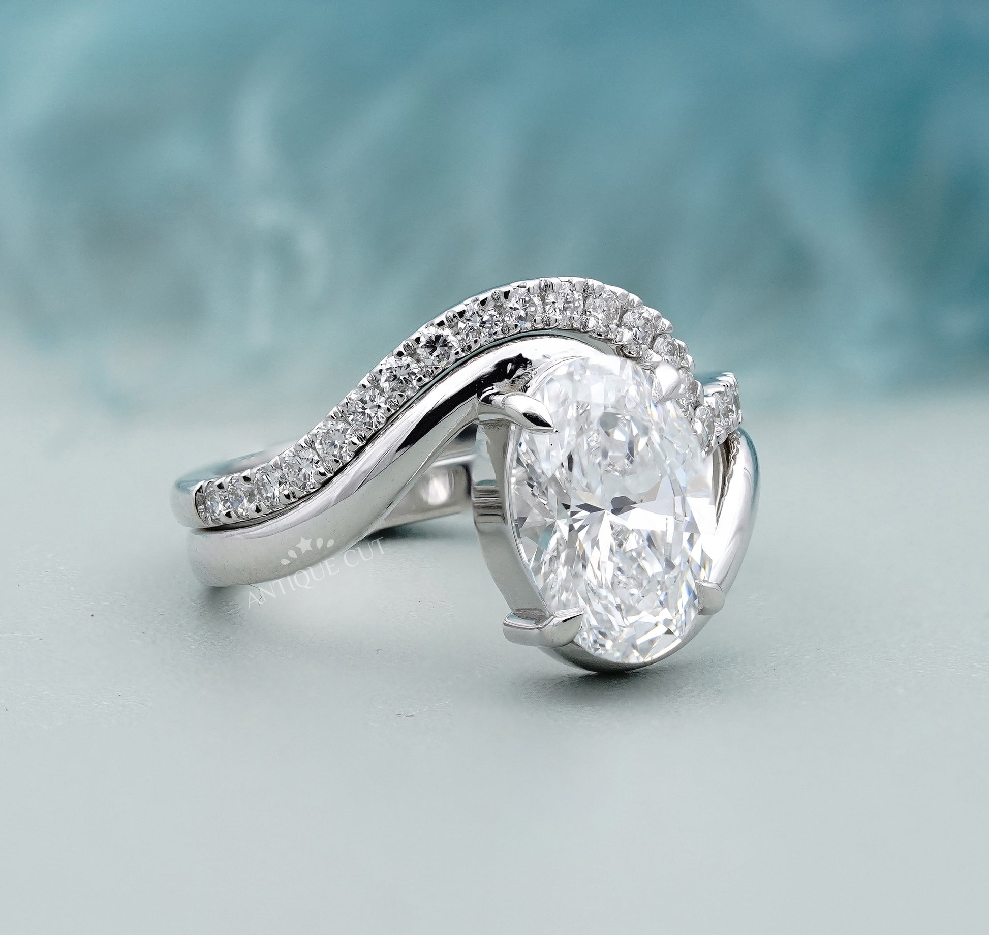 Oval bypass engagement ring claw prong setting