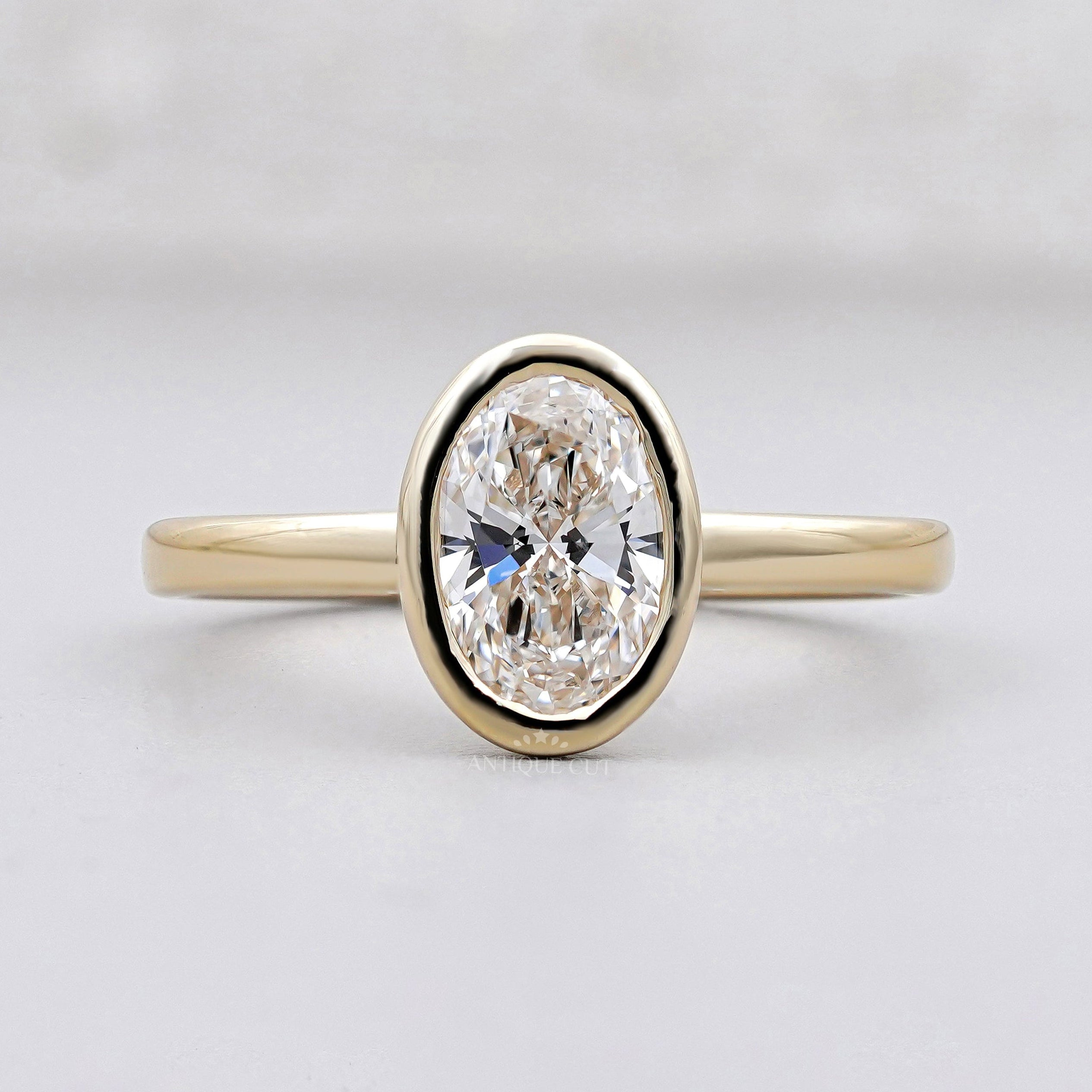 Oval diamond solitaire ring in yellow gold