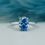 Blue diamond solitaire ring hidden halo oval 4 prong white gold
