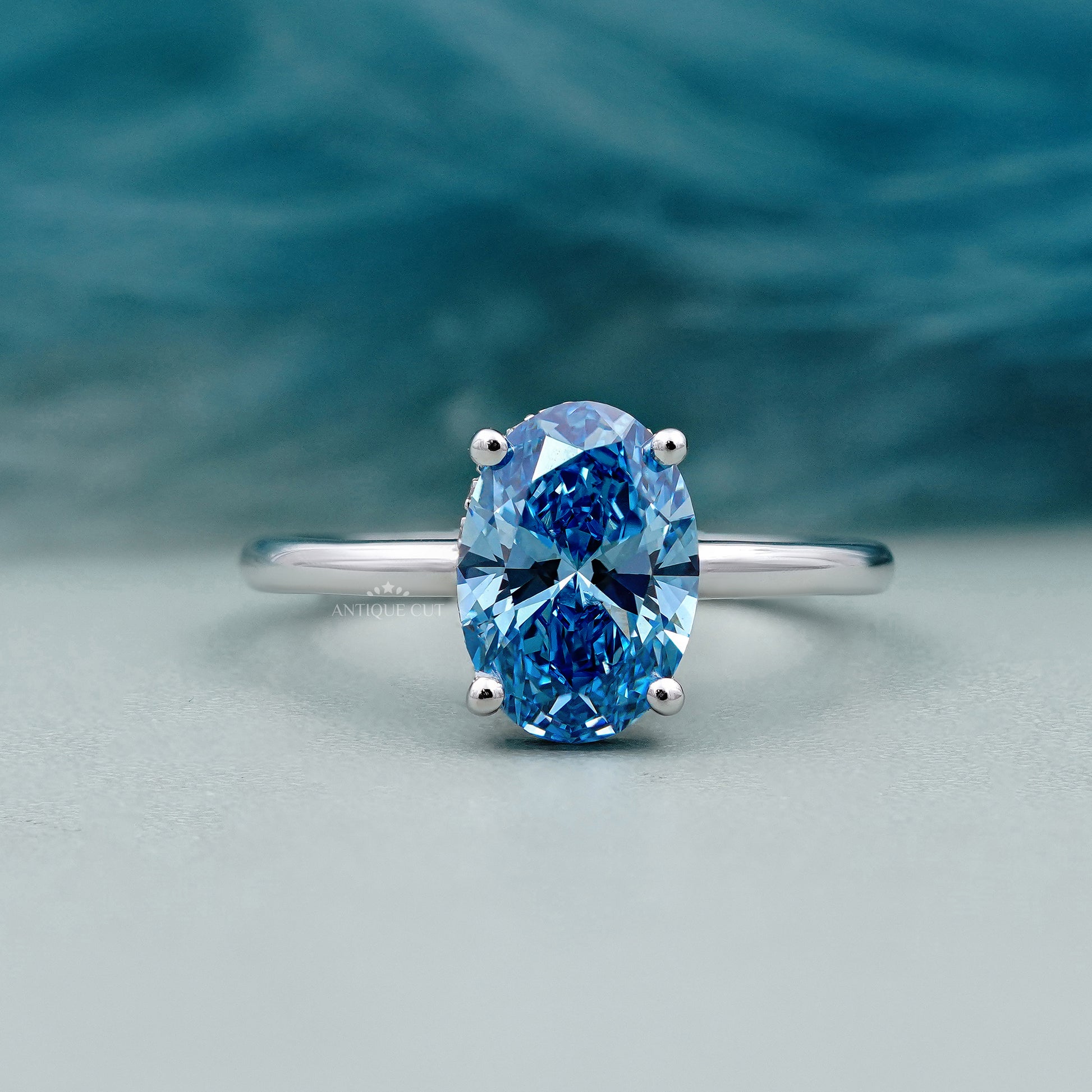 Blue diamond solitaire ring hidden halo oval 4 prong white gold