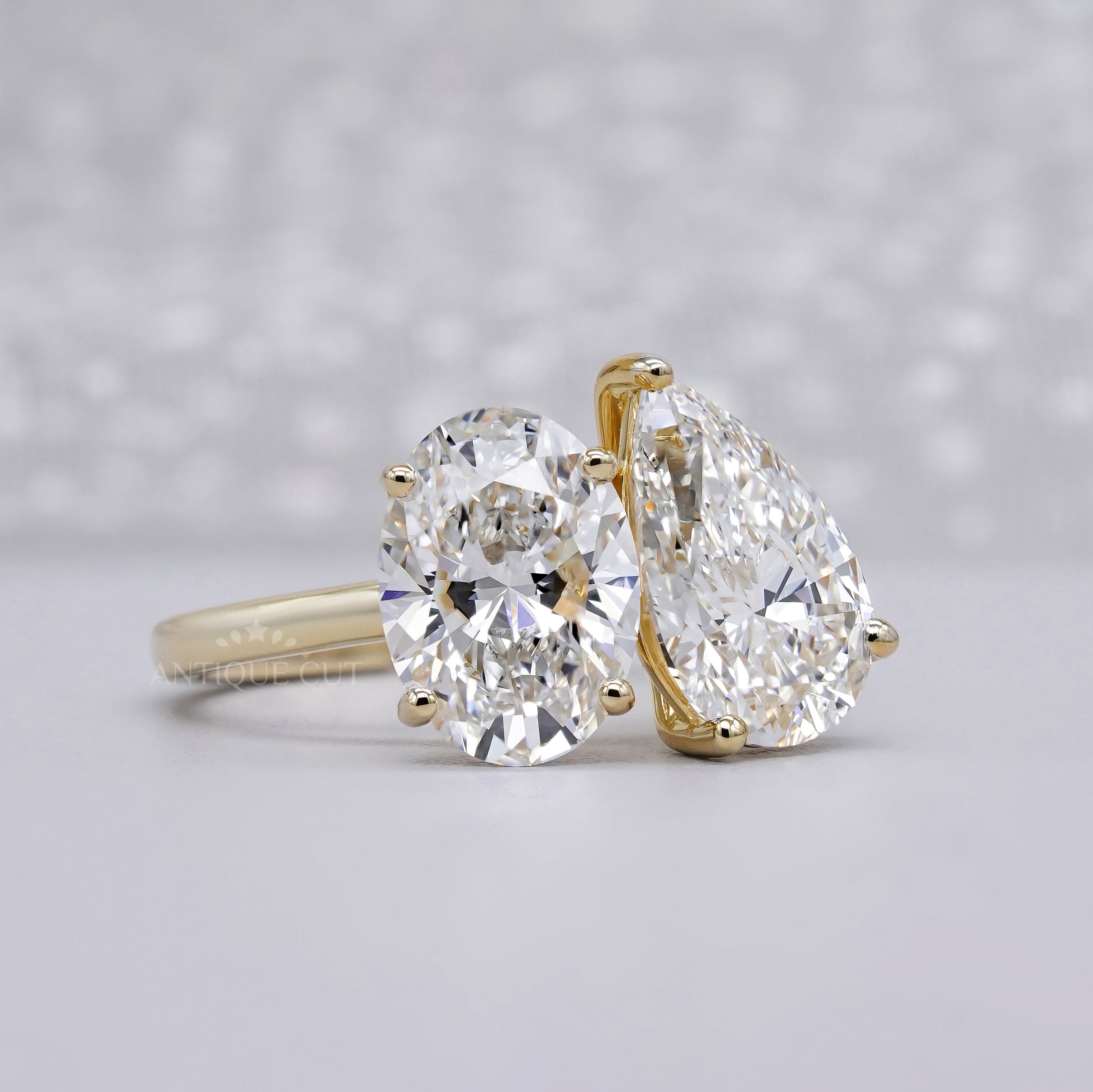 Yellow gold oval and pear lab grown diamond ring