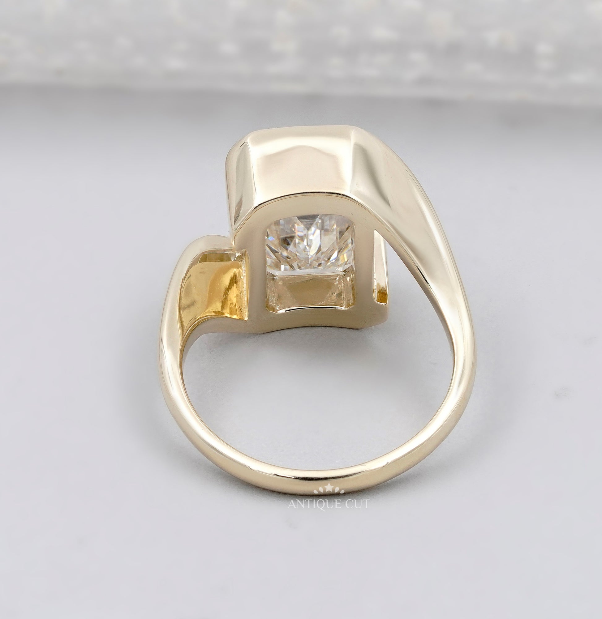 Emerald Cut Engagement Ring with Half Bezel Set