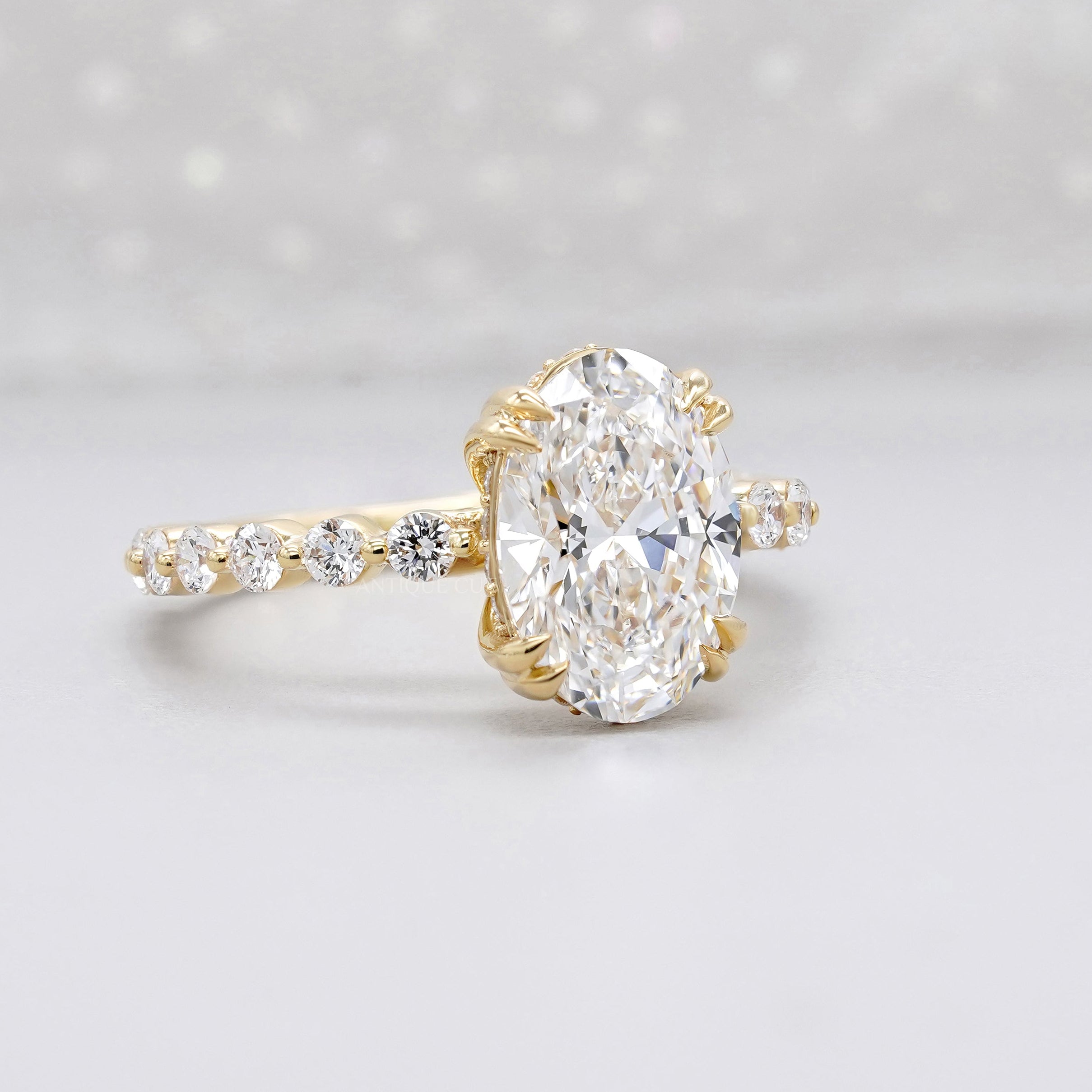 Yellow gold oval hidden halo diamond ring