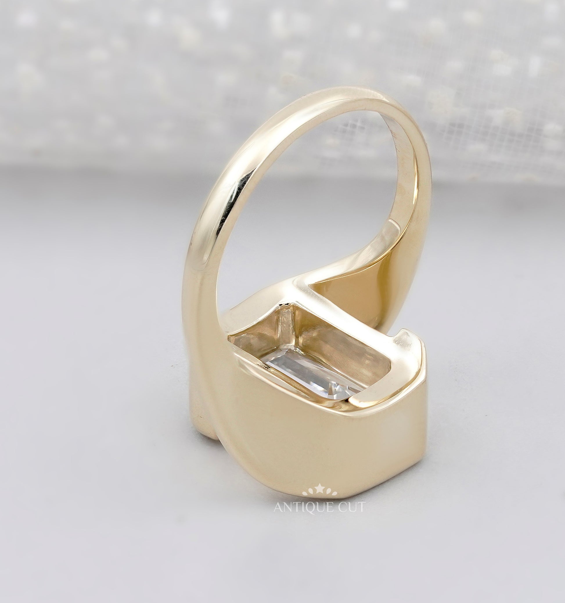 Emerald Cut Engagement Ring with Half Bezel Set