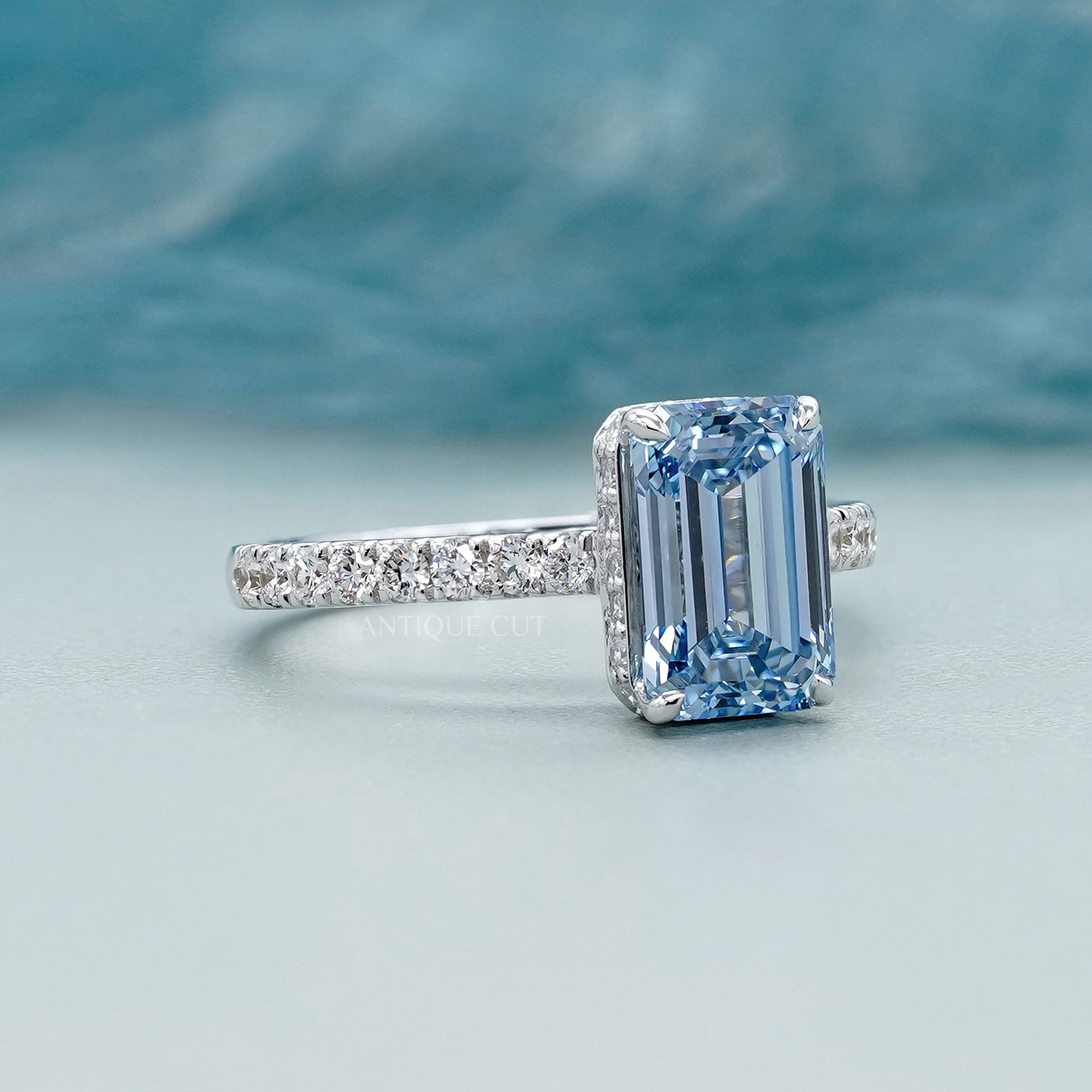 White gold blue emerald diamond engagement ring 4 prong