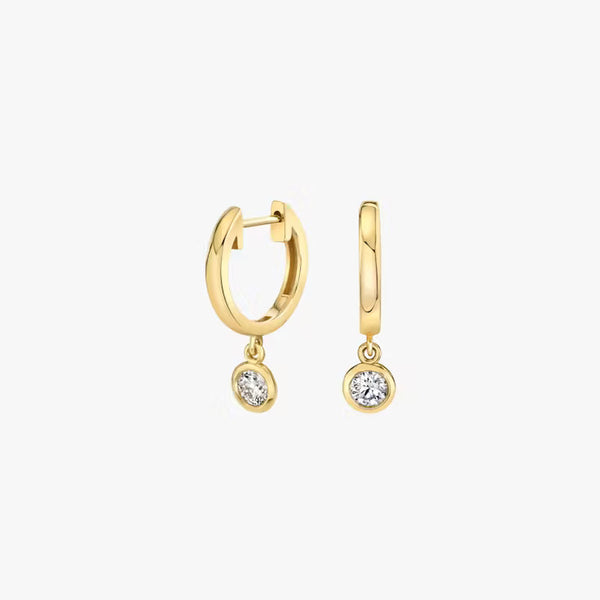 Round gold huggie earrings with diamond dangle detail