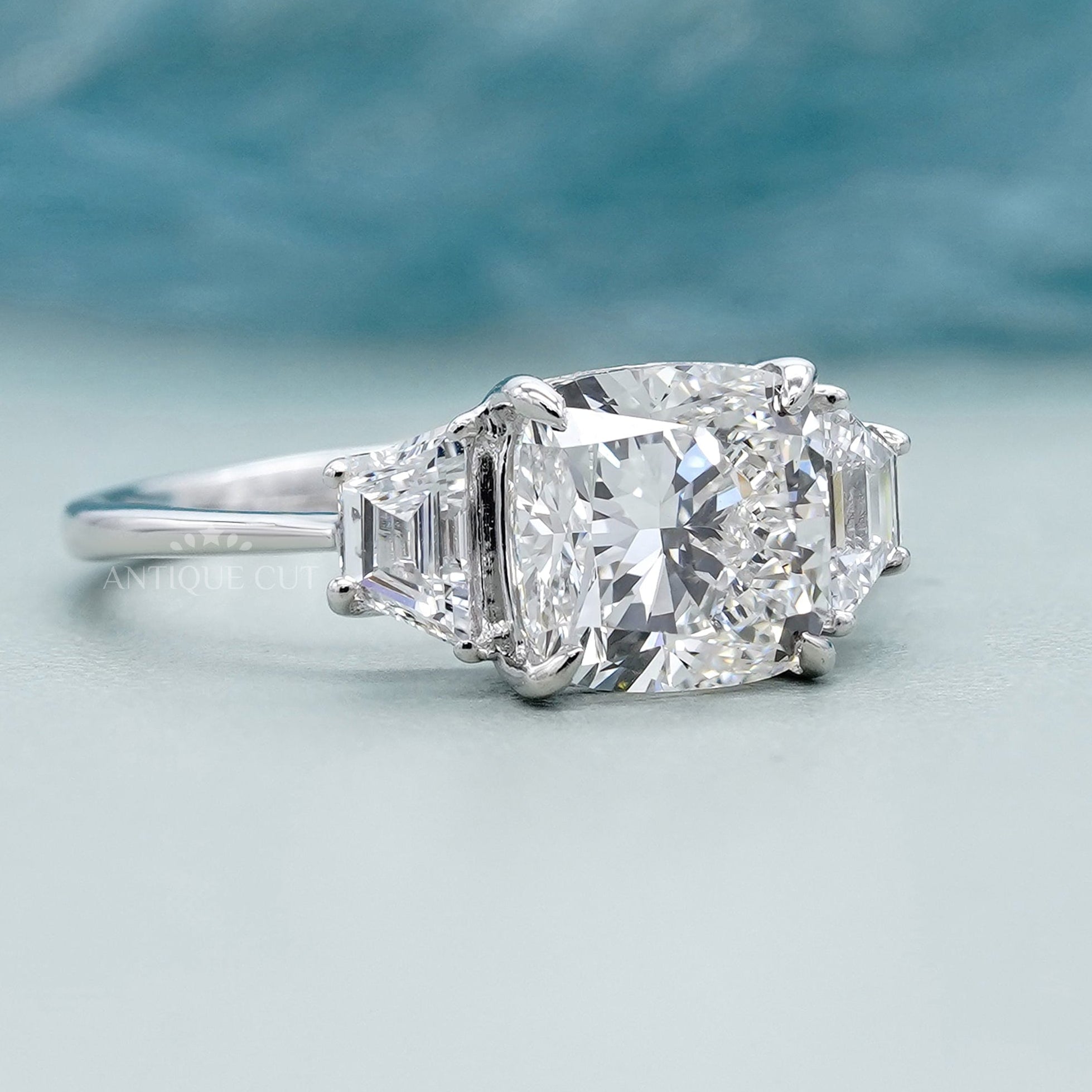 Elegant cushion cut diamond ring with side baguettes