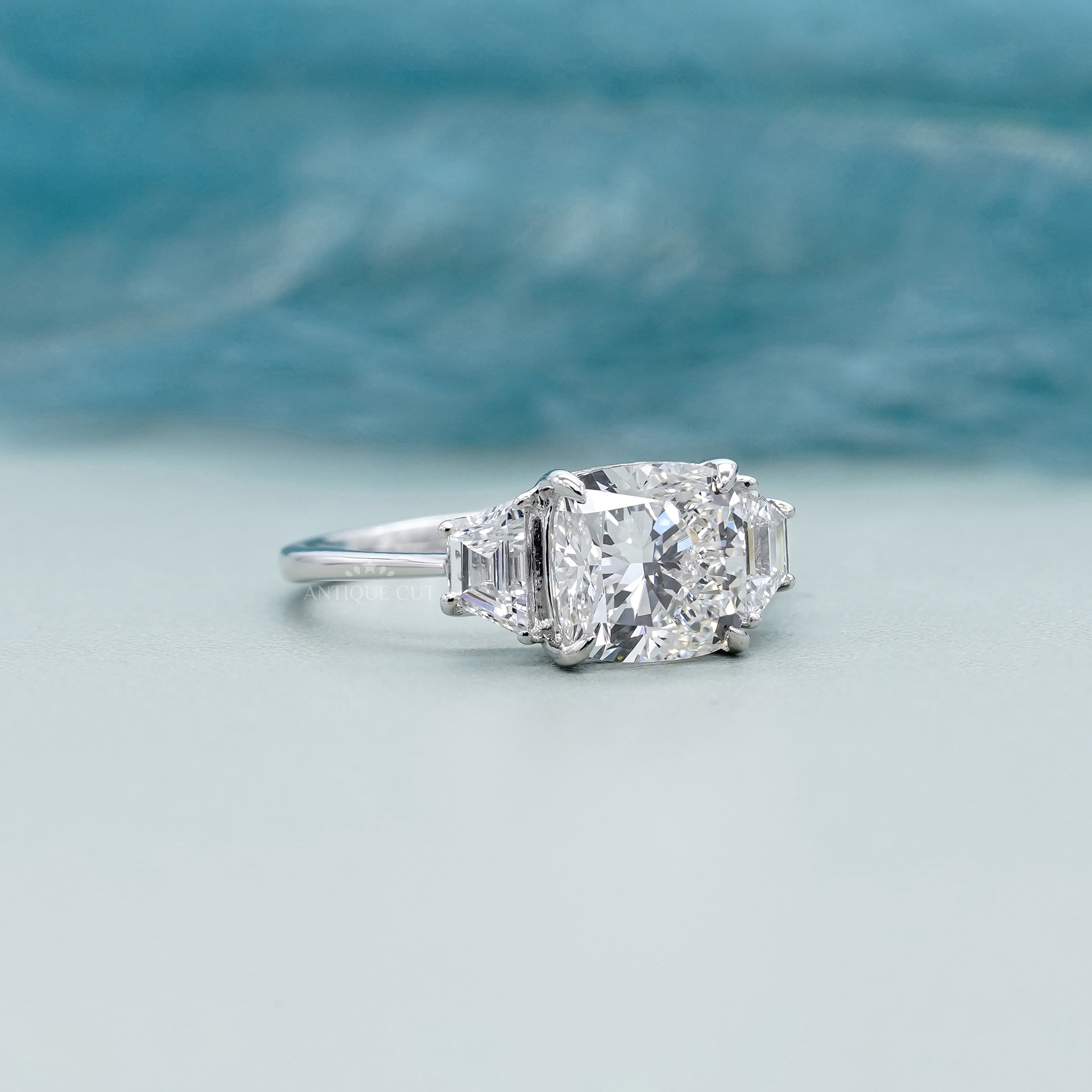 Elegant cushion cut diamond ring with side baguettes
