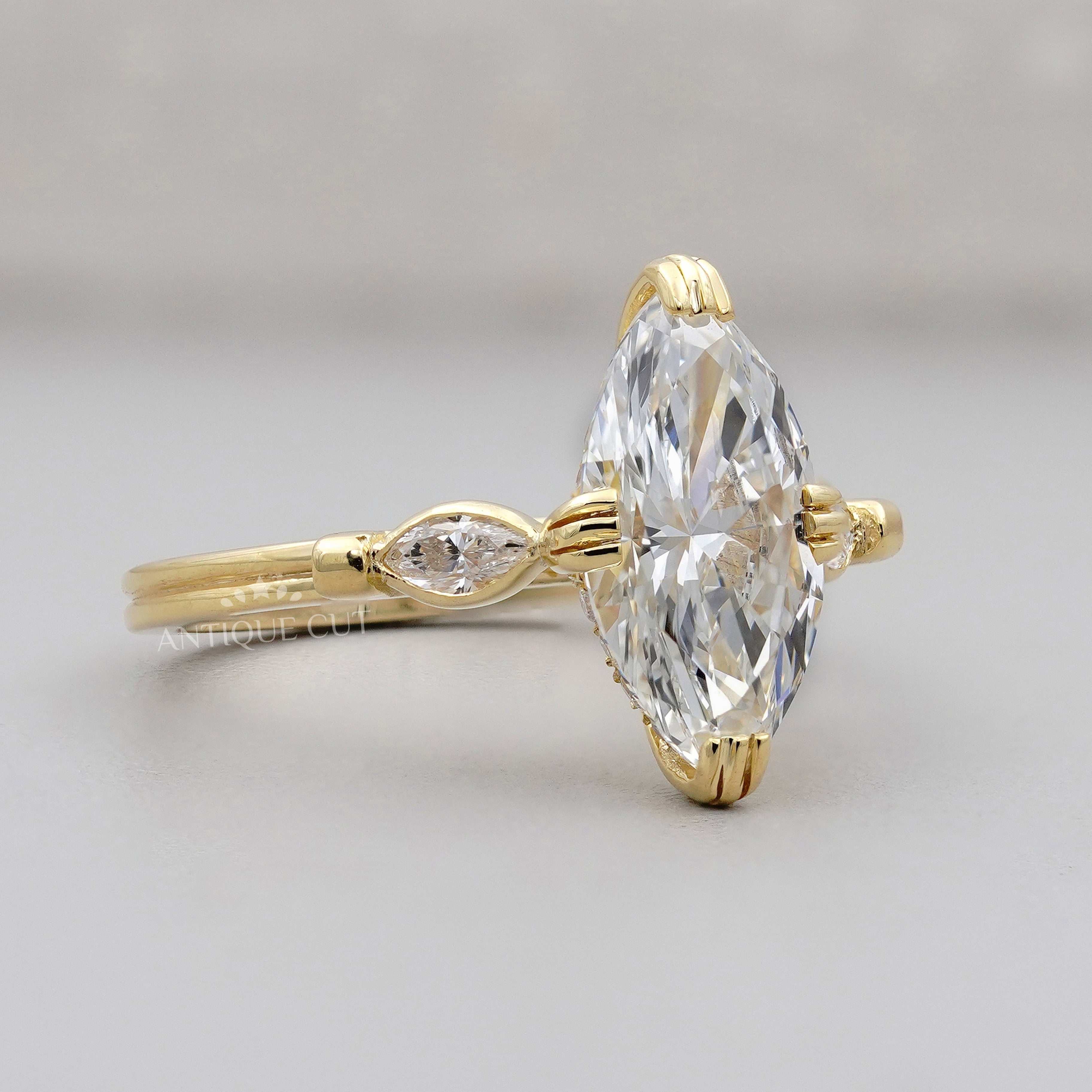 Hidden halo marquise engagement ring in yellow gold