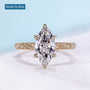 Vintage marquise engagement ring with hidden halo and yellow gold setting
