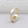 modern bezel set emerald cut ring