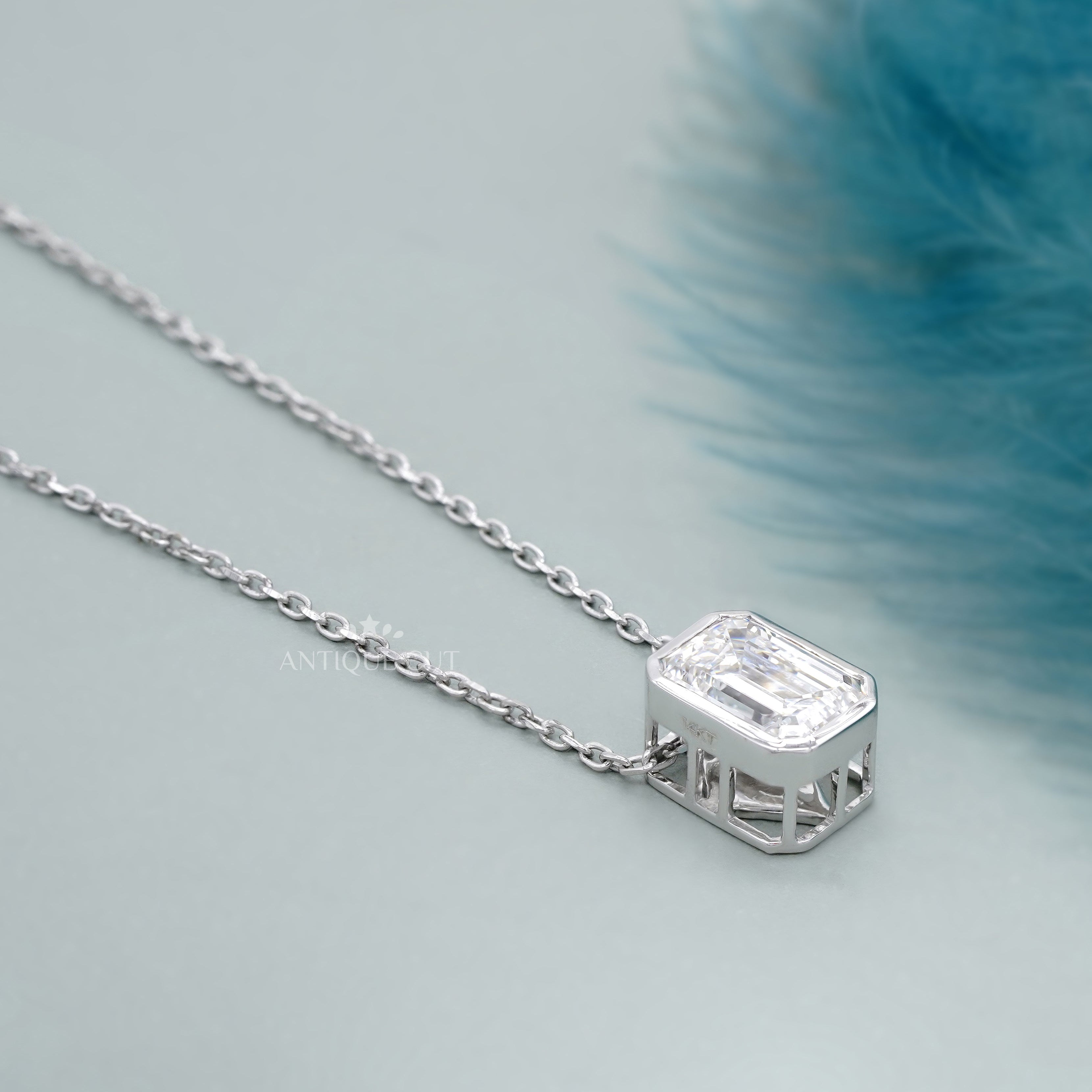 Bezel emerald cut diamond pendant necklace in white gold