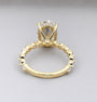 Oval center stone ring with shared-prong accent band