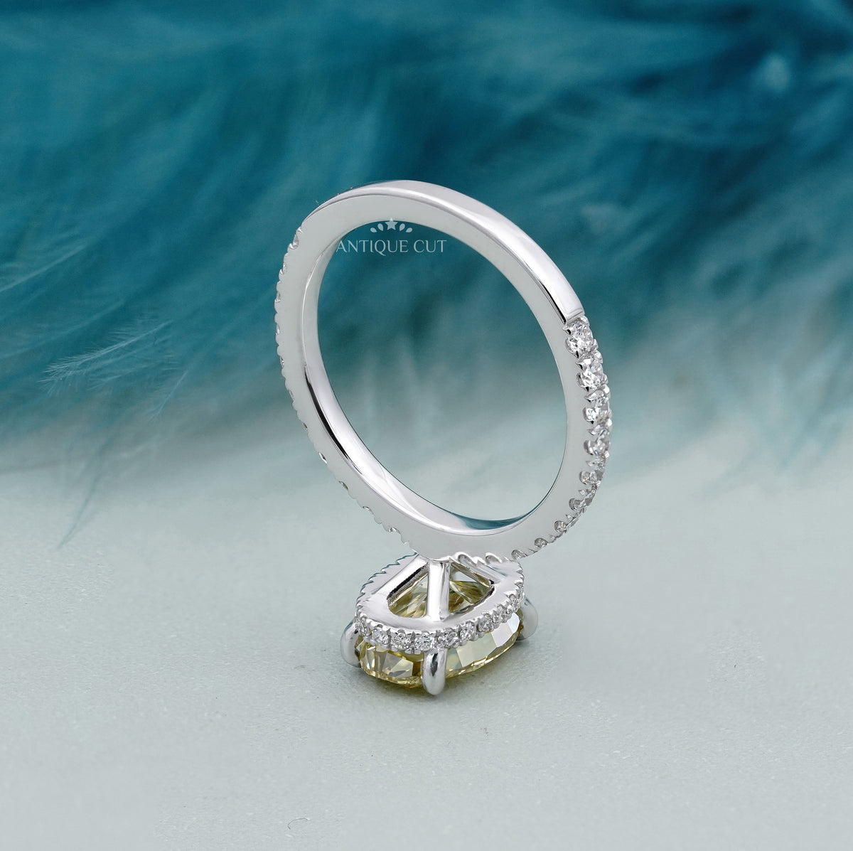 Yellow center diamond ring with pavé shoulders