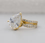 Pear shaped lab grown diamond ring with round side stones