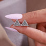White gold stud earrings featuring round diamonds