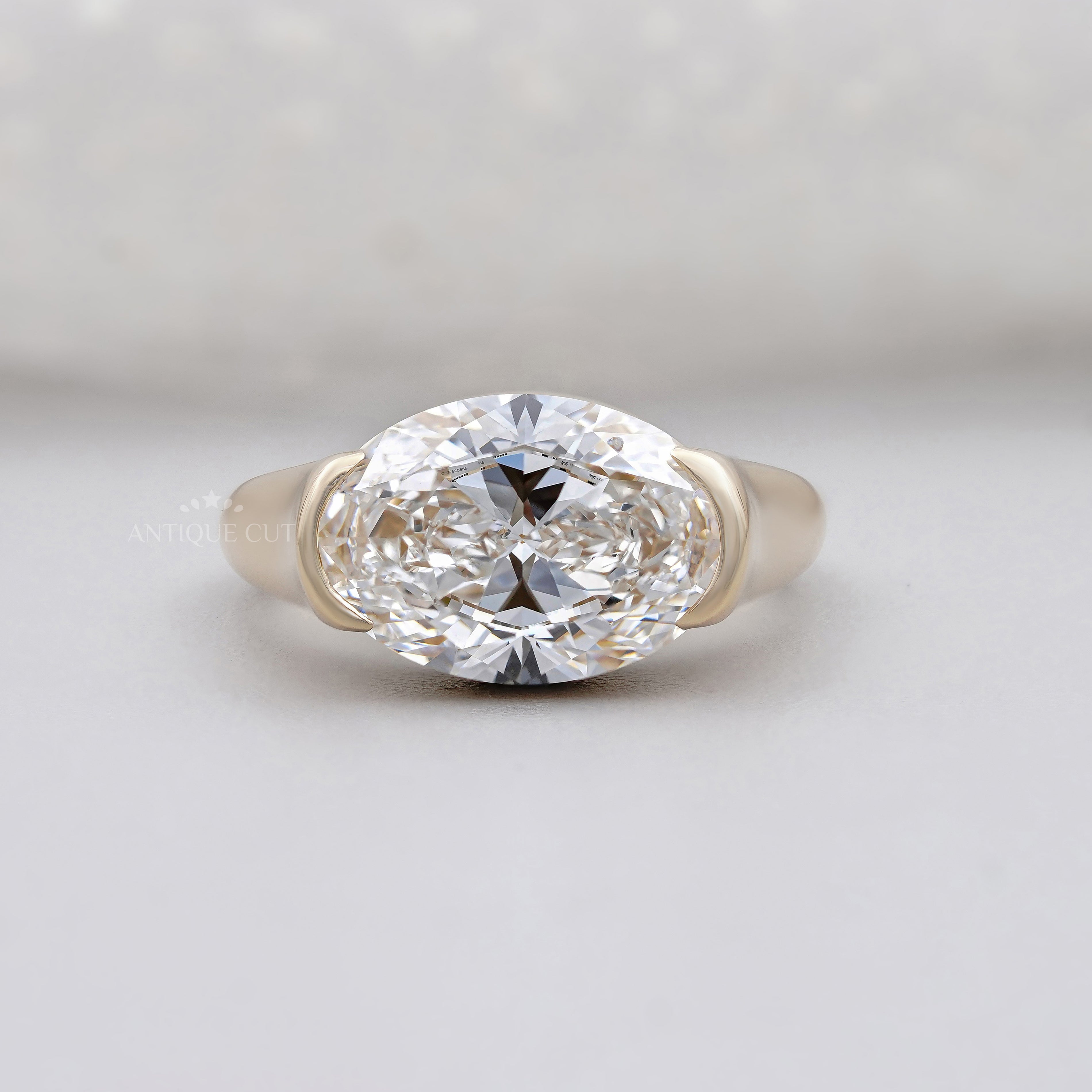 East West Oval Half Bezel Engagement Ring