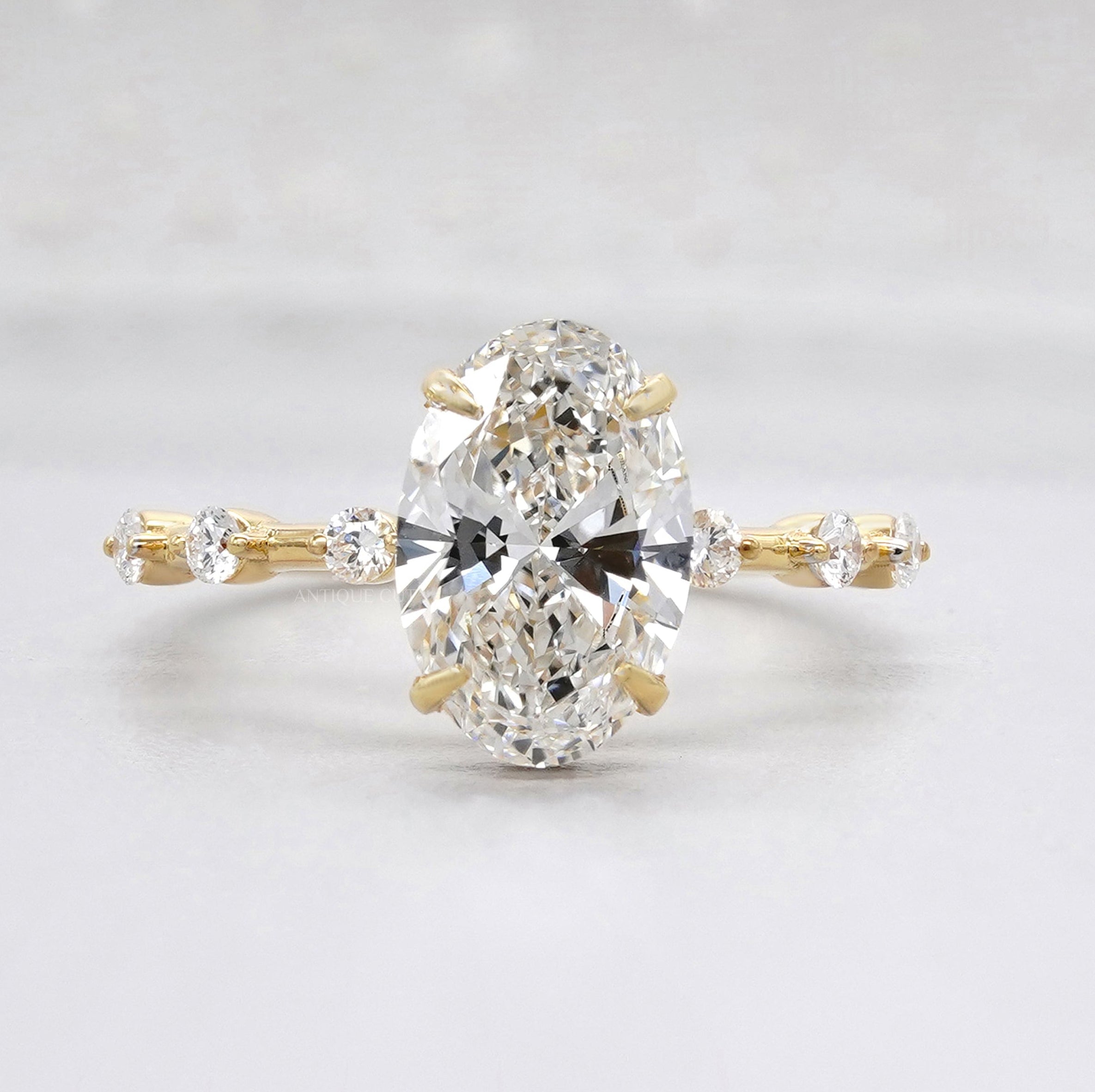 Oval cut hidden halo diamond engagement ring