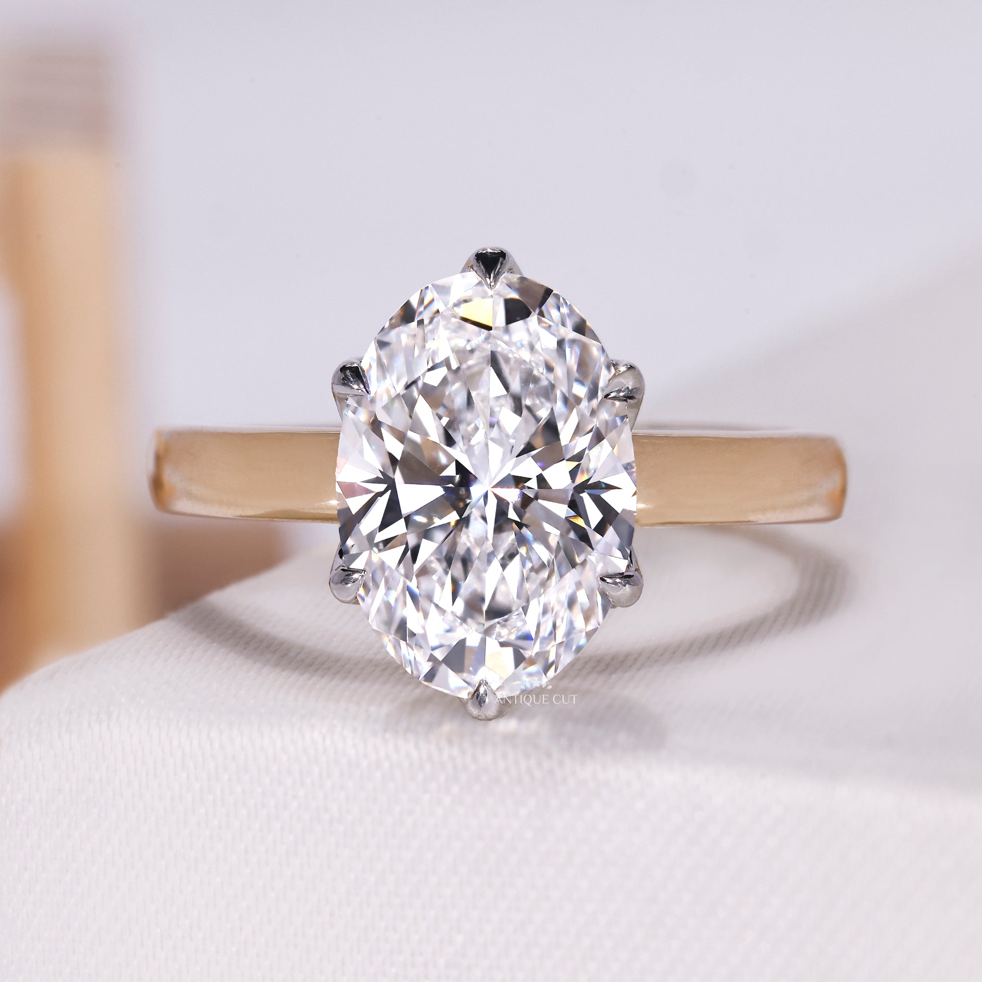 Oval cut lab grown engagement ring with hidden halo