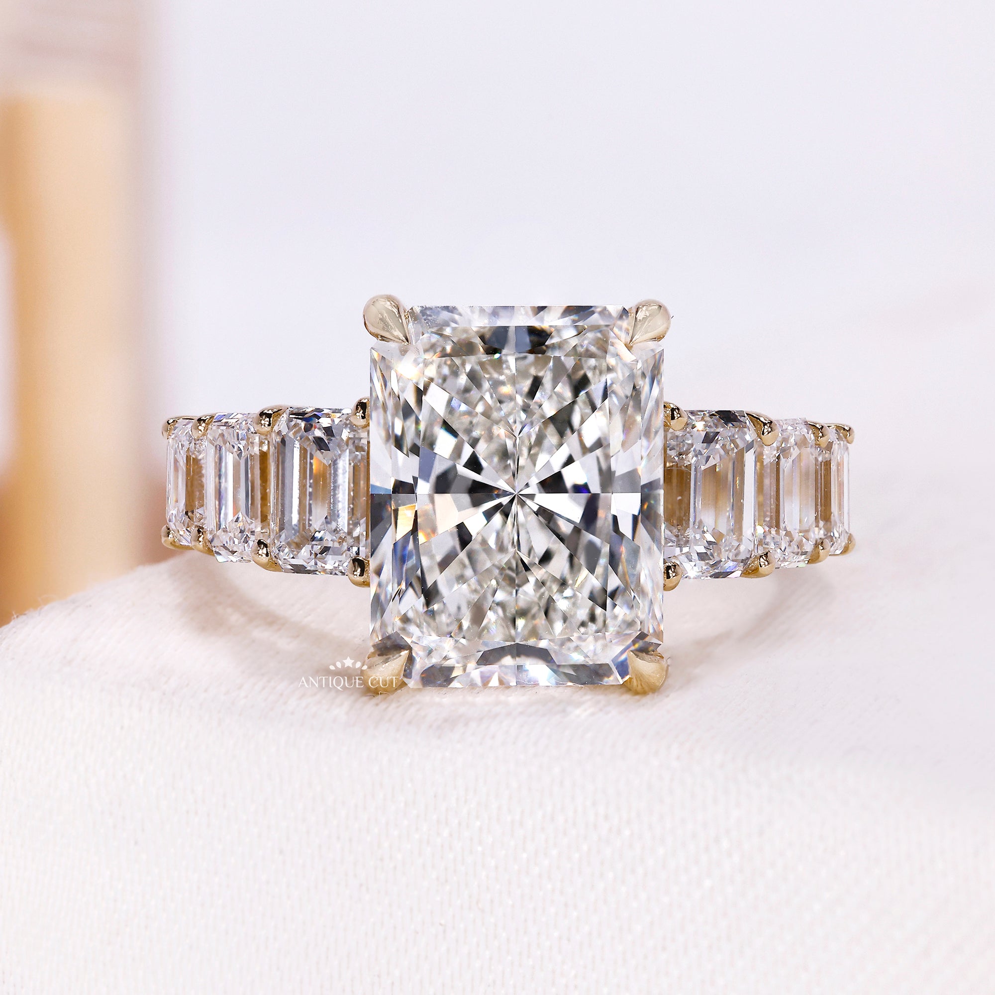 5.00 carat radiant cut engagement ring with emerald cut side stones