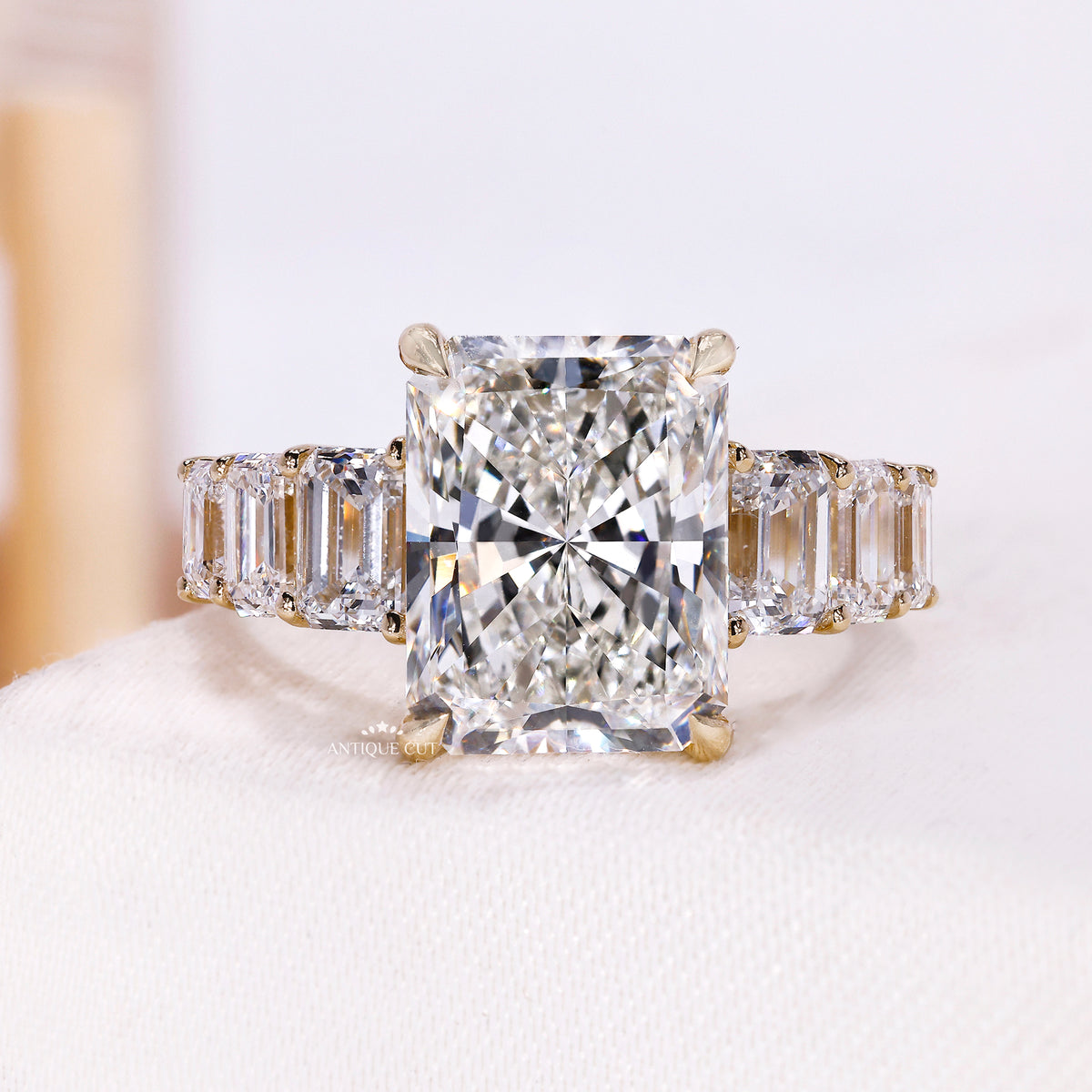 5.00 carat radiant cut engagement ring with emerald cut side stones