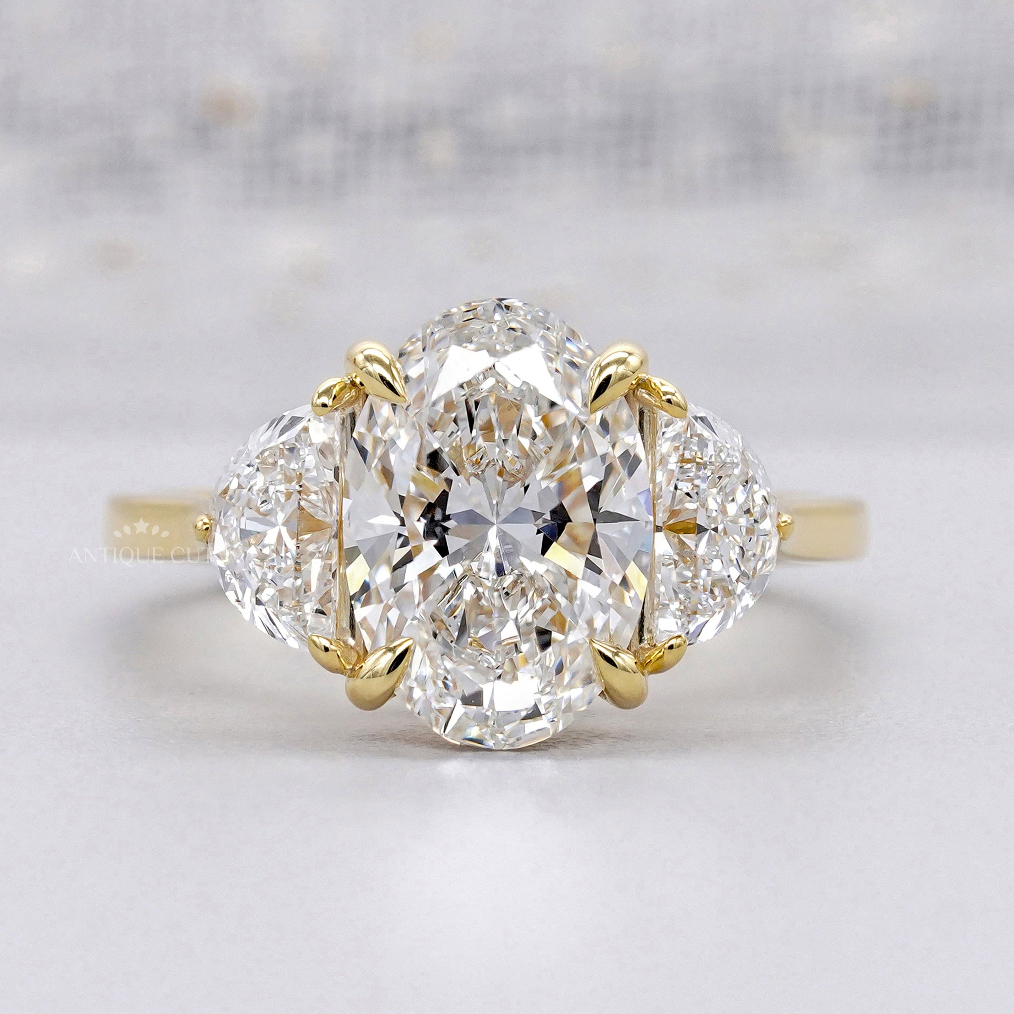 Oval shaped engagement ring with three stone diamond
